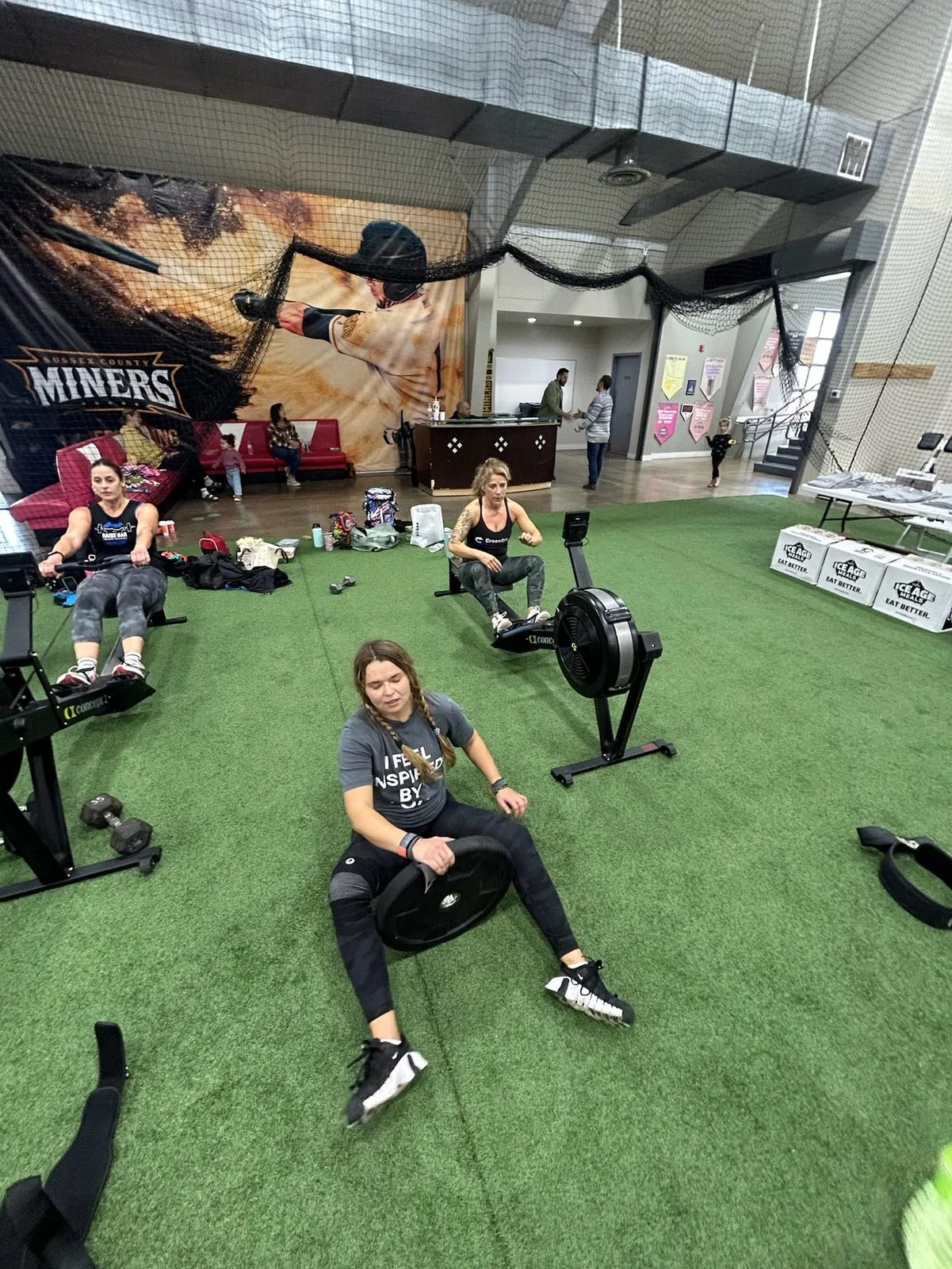 Participants row and recover between exercises at DT’s Row 2025.