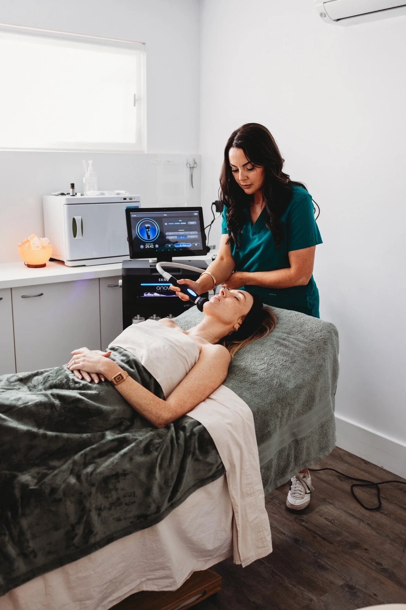 Nurse Alanna using the SKNBAR device during a facial treatment at the Bribie Island clinic