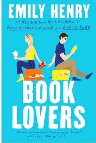 Cover of the book 'Book Lovers' by Emily Henry, featuring a man and woman sitting back-to-back reading. The woman has blonde hair and is in a yellow shirt, while the man has dark hair, glasses, and is in a blue shirt. They are sitting on suitcases with travel essentials around them.