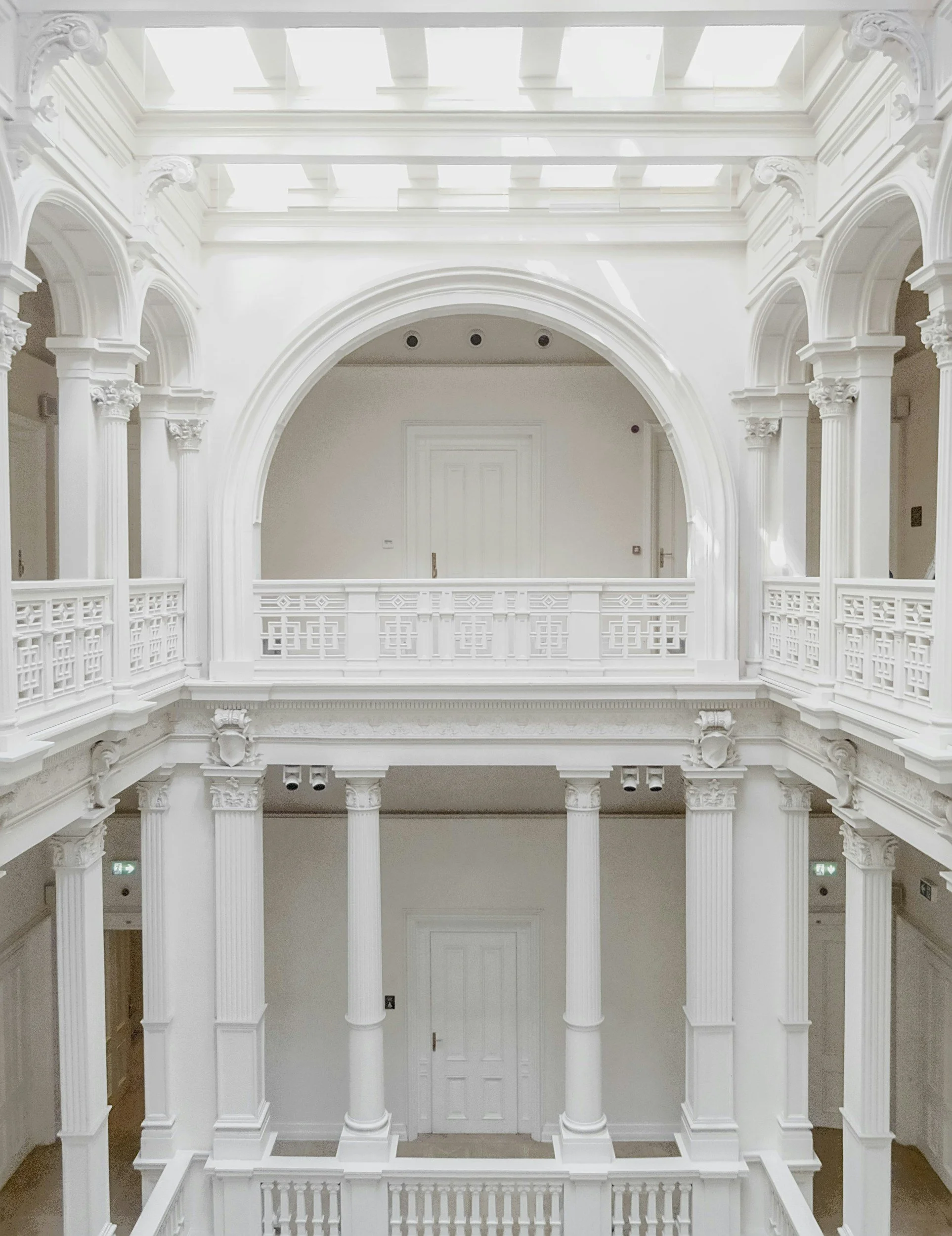 Calm and private hallway with natural light, neutral décor, and inviting, emphasizing discretion and comfort.