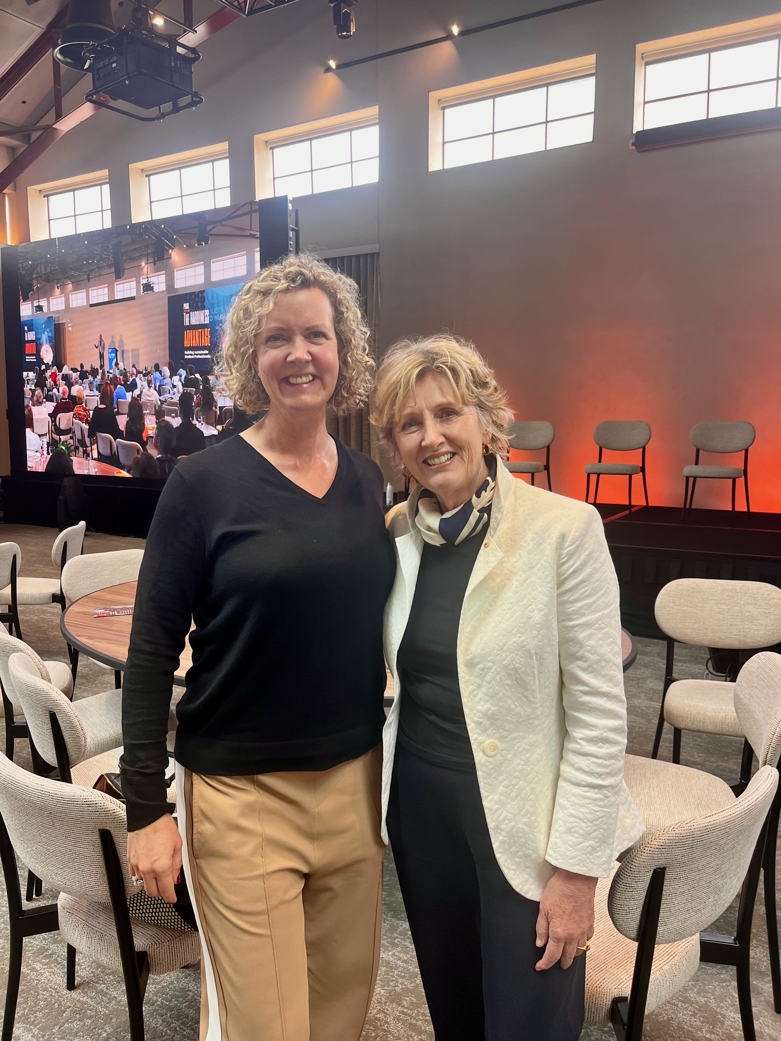 Dr Jo Braid standing with Dr Leanne Rowe AM at the Australasian Doctors' Health Conference 2025
