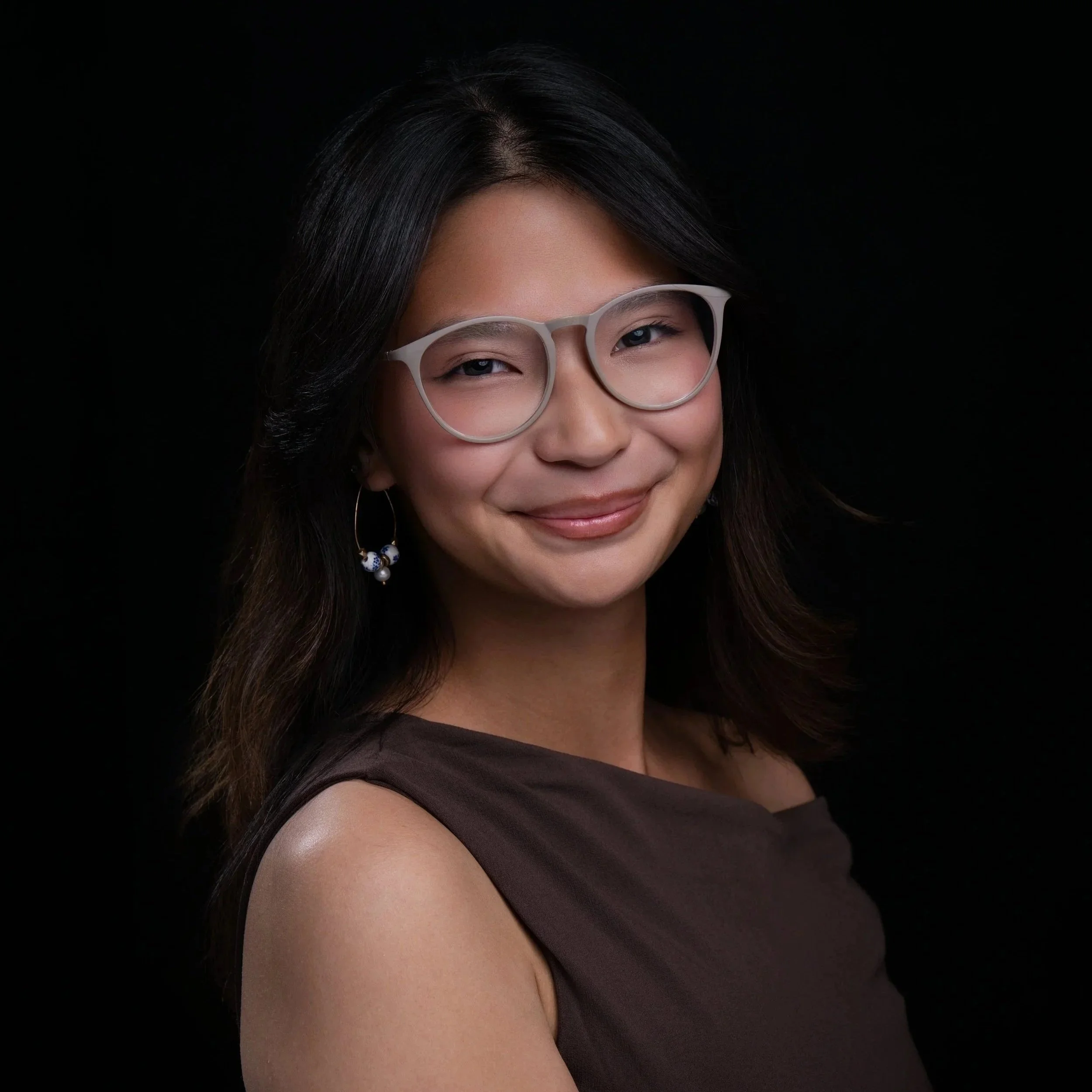Photo of CEO, Razelle, with glasses