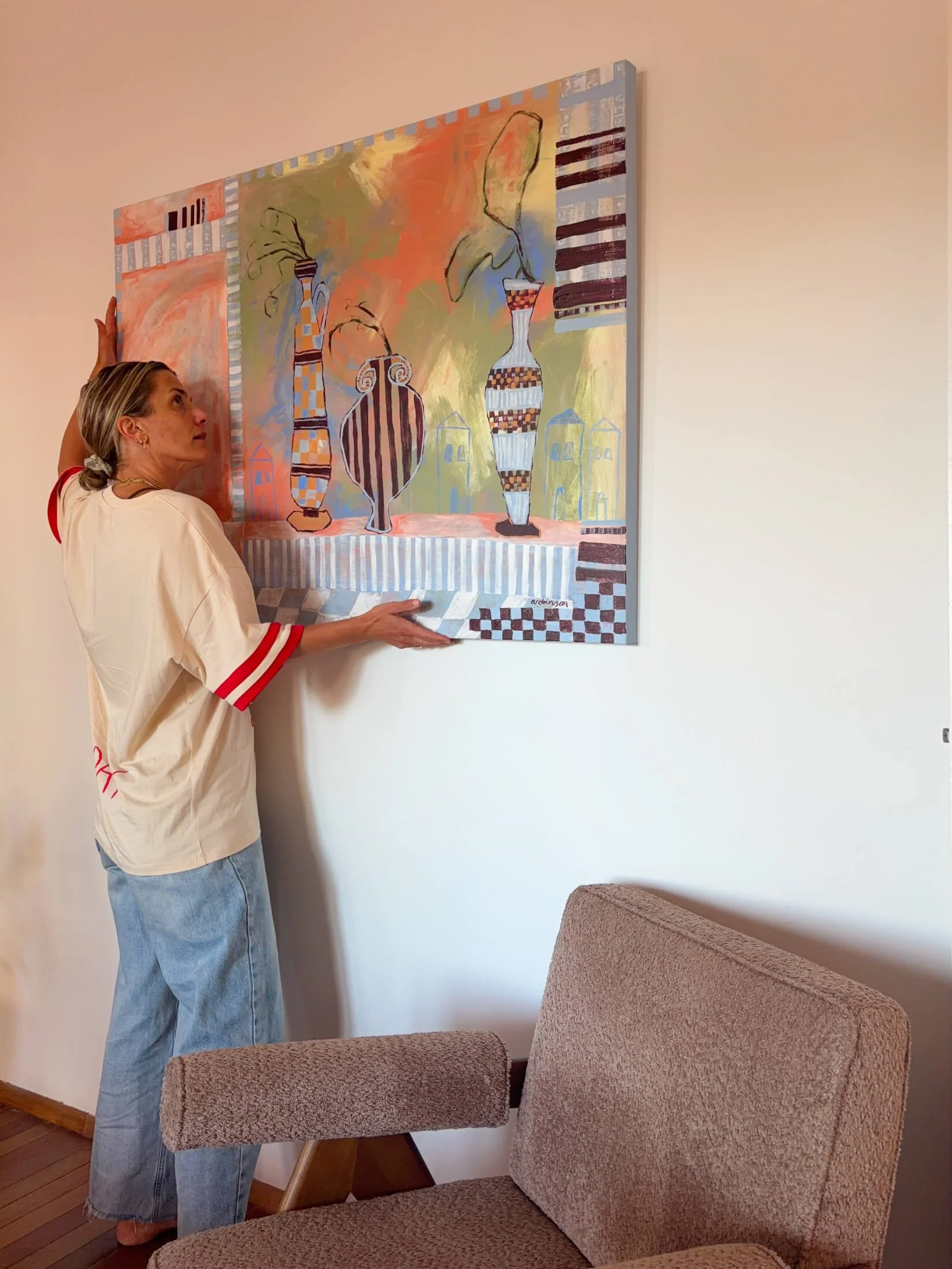 anita-robinson.jpg Anita Robinson standing beside Late Checkout original painting
