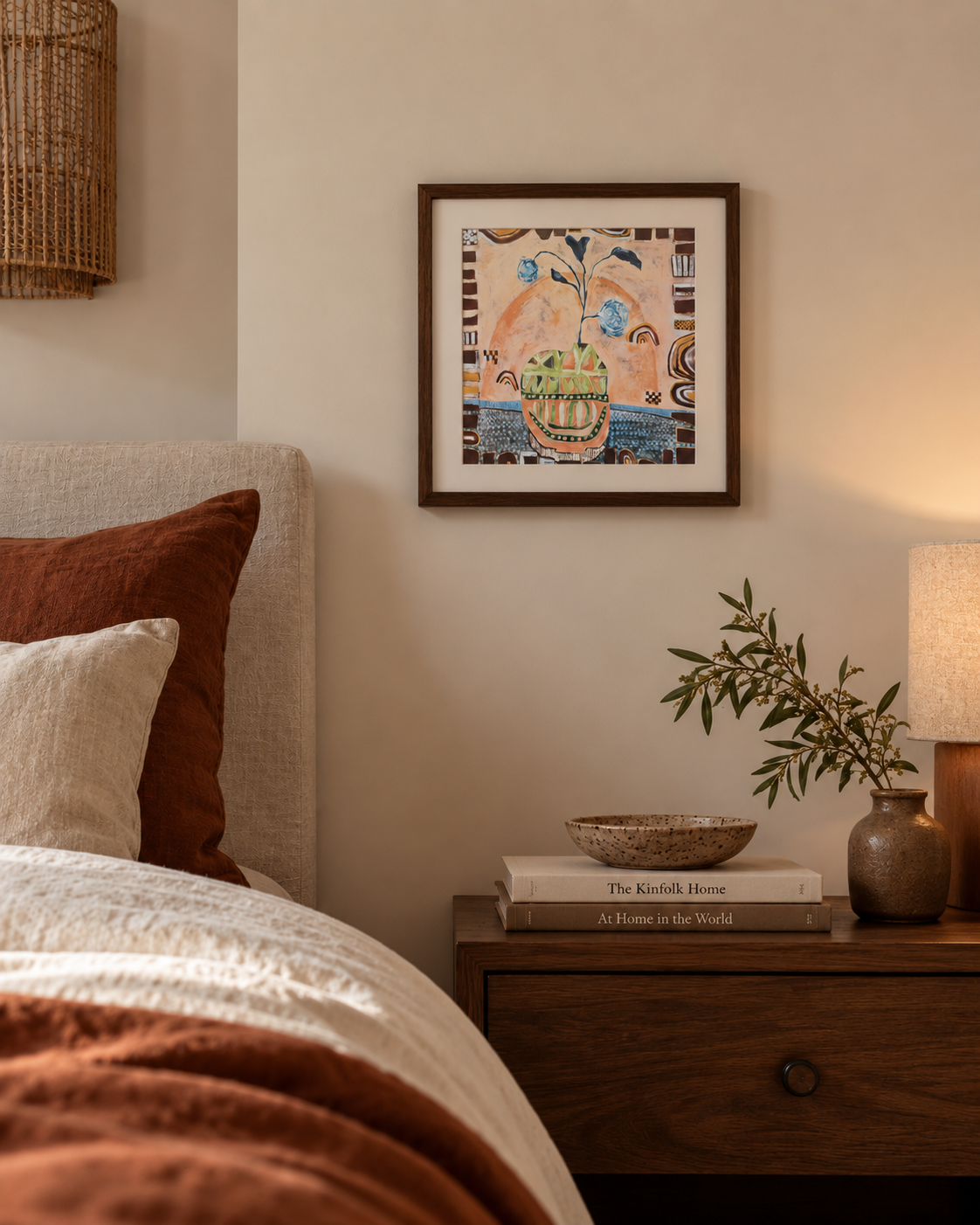 Hidden in the Leaves 40 x 40cm abstract fine art print by Sydney artist Anita Robinson styled in a warm bedroom with a dark timber frame.