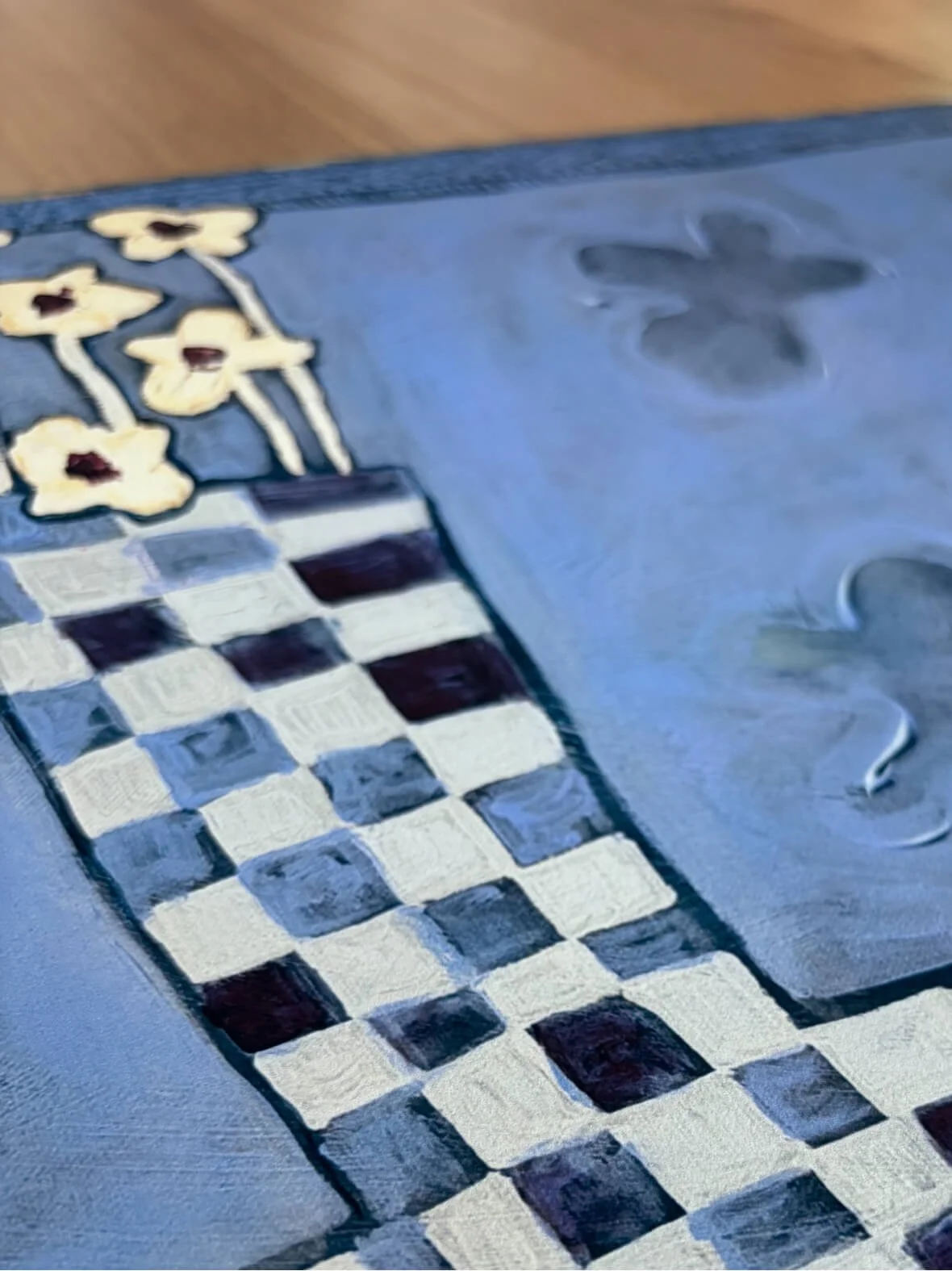 Close-up detail of Stillness in Blue fine art print showing checkerboard vase and blue background