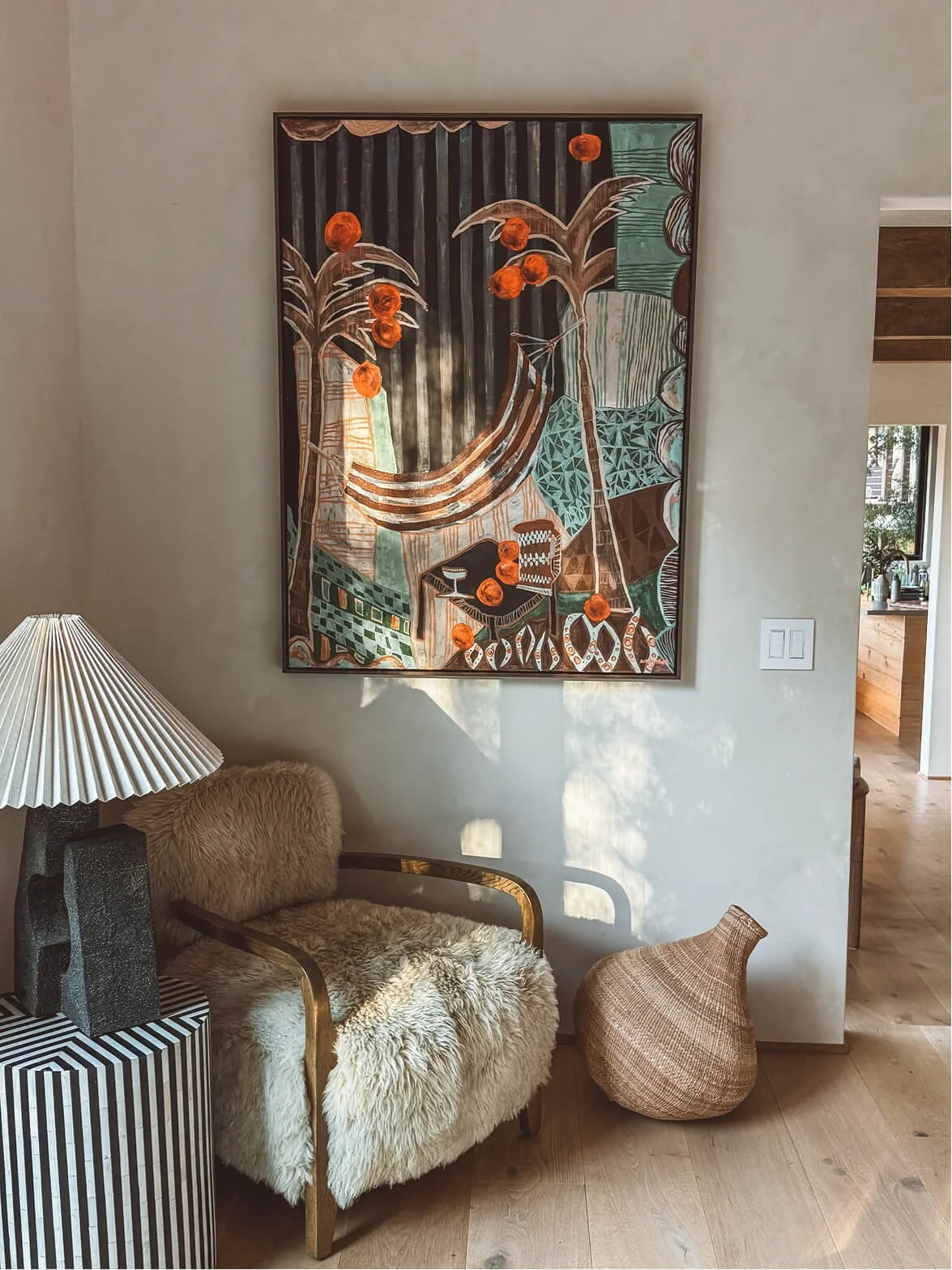 Falling Orange original artwork by Anita Robinson in a light-filled Los Angeles home interior.