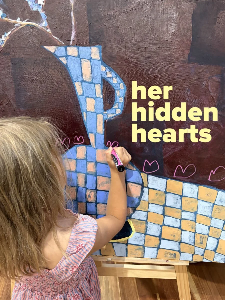 Sage painting hidden heart details onto After the Picnic original artwork