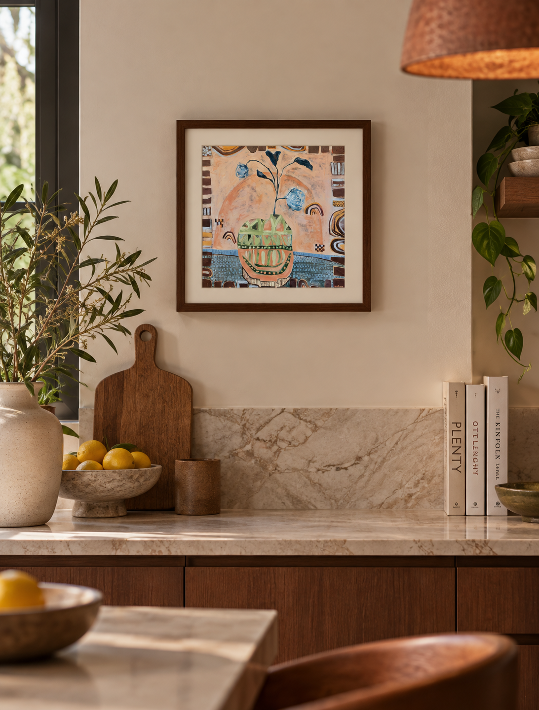 Hidden in the Leaves 40 x 40cm abstract fine art print by Sydney artist Anita Robinson styled in a warm modern kitchen with a dark timber frame.