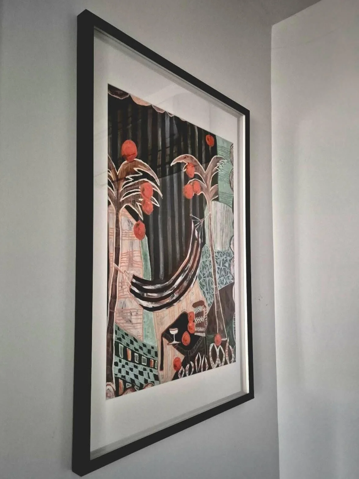 Framed Falling Orange fine art print by Anita Robinson displayed in a home interior.