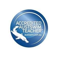Blue circular badge with a white shark silhouette and the text 'ACCREDITED AUSTSWIM TEACHER' and 'austswim.com.au'.