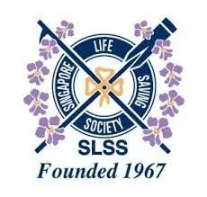 Logo with two crossed syringes and a ribbon, surrounded by purple flowers, with text reading 'Singapore Police Life Saving Society' and 'Founded 1967'.