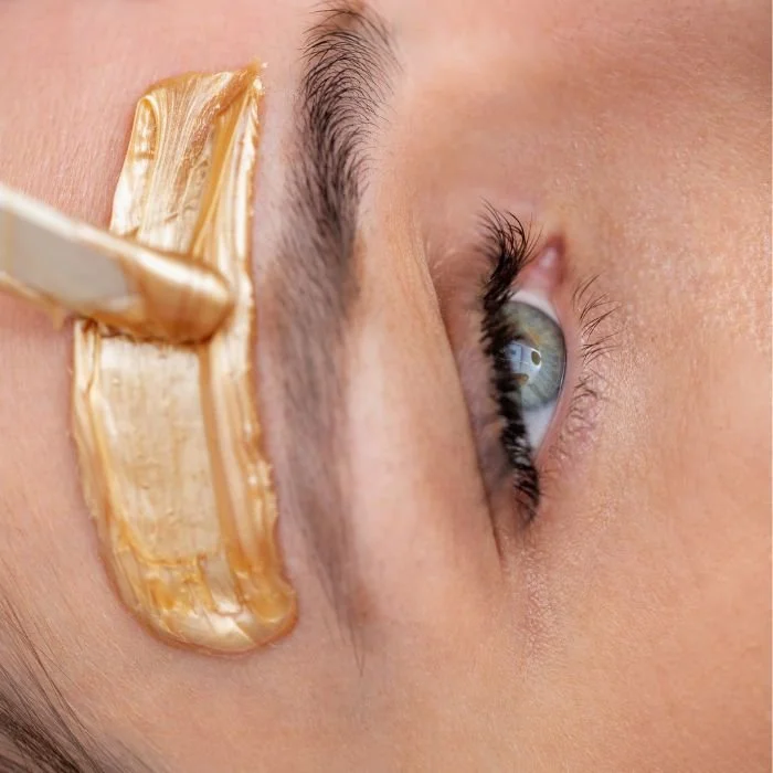 lady having her eyebrows waxed.