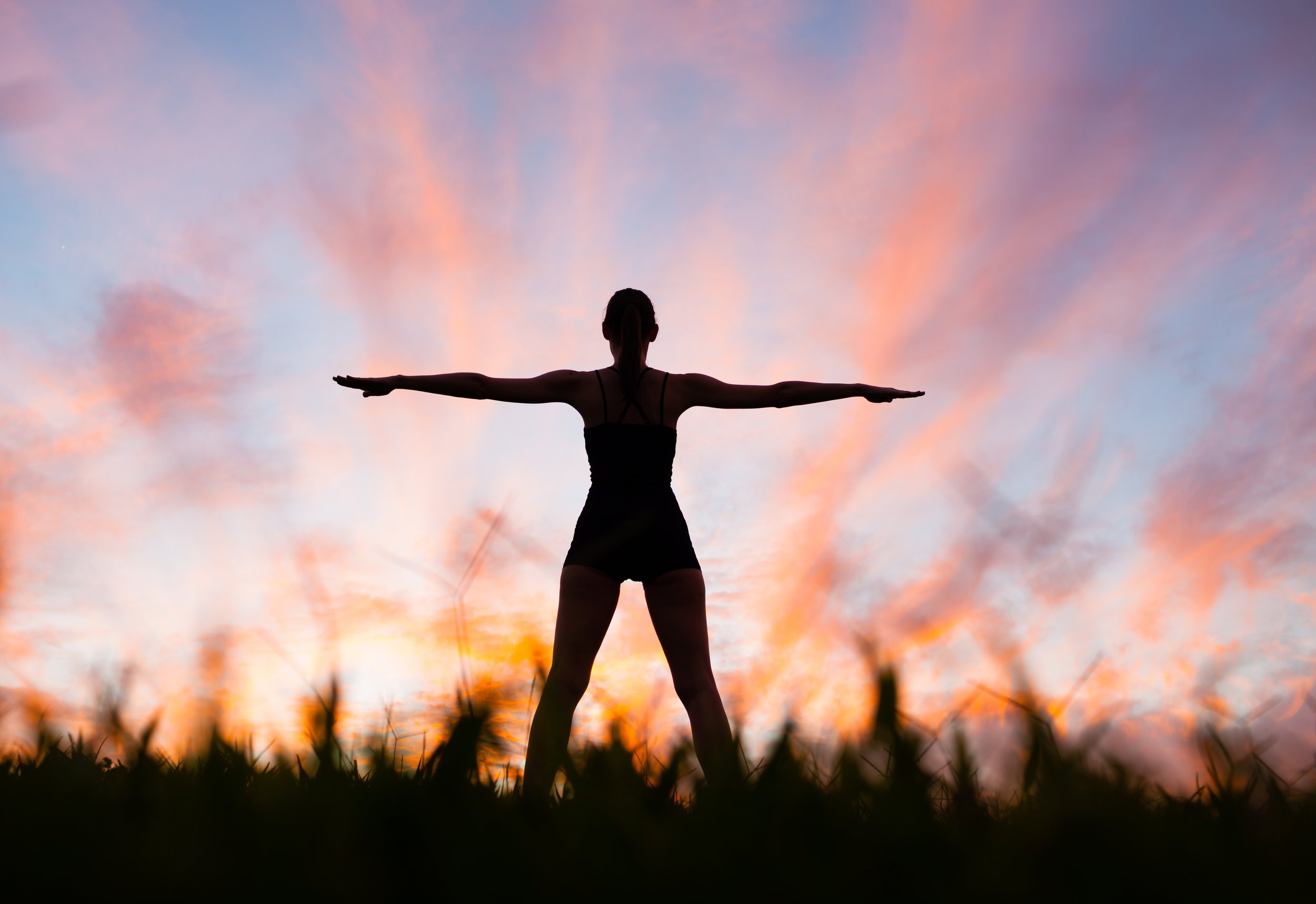 Silhouete of women standing in field