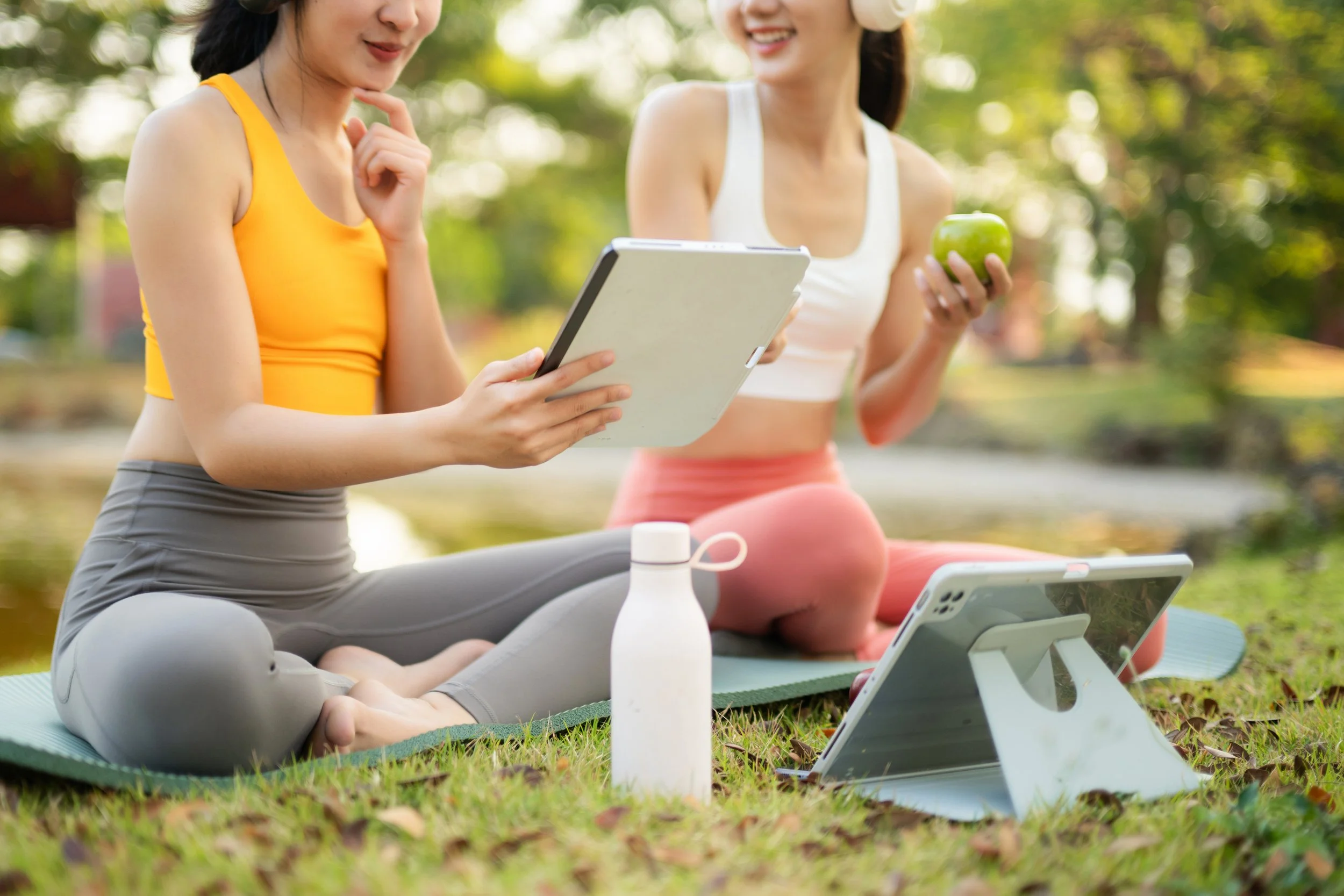 women looking at the energetics app on a tablet