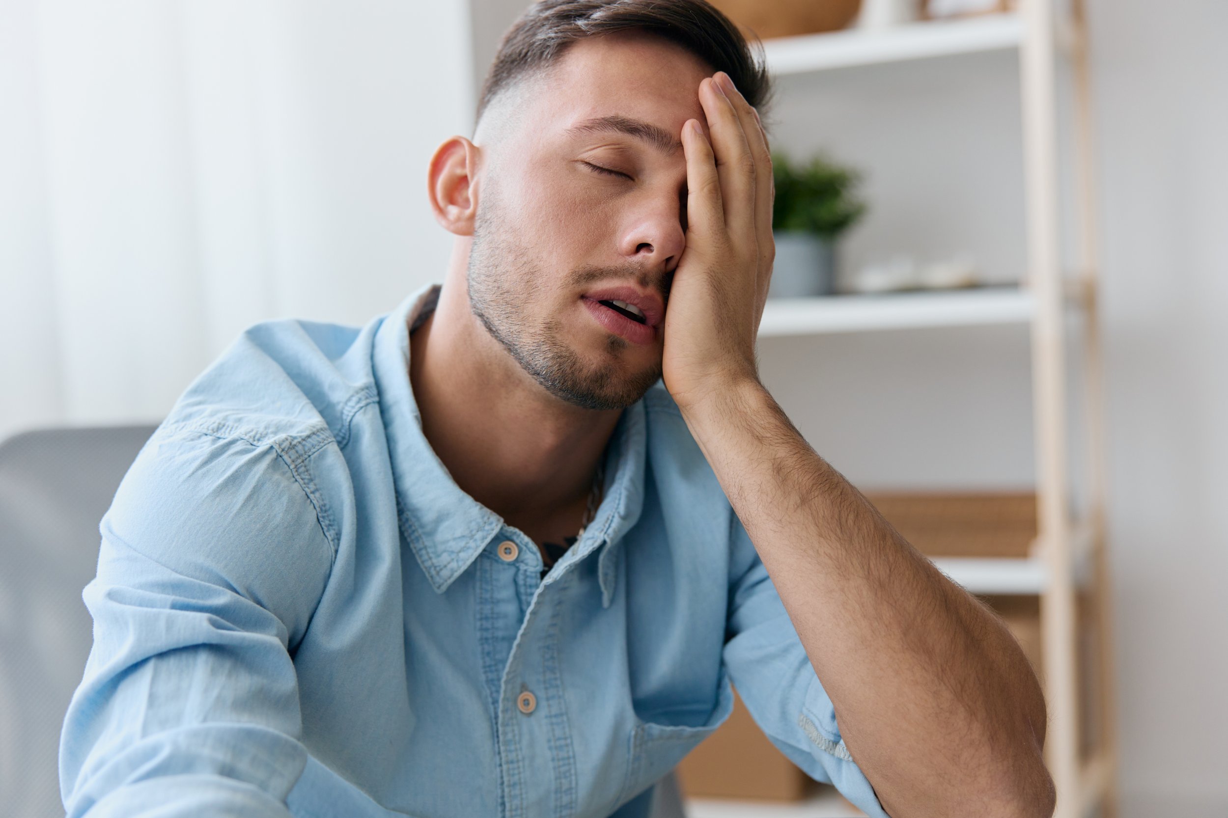tired man with a biofield out of sync