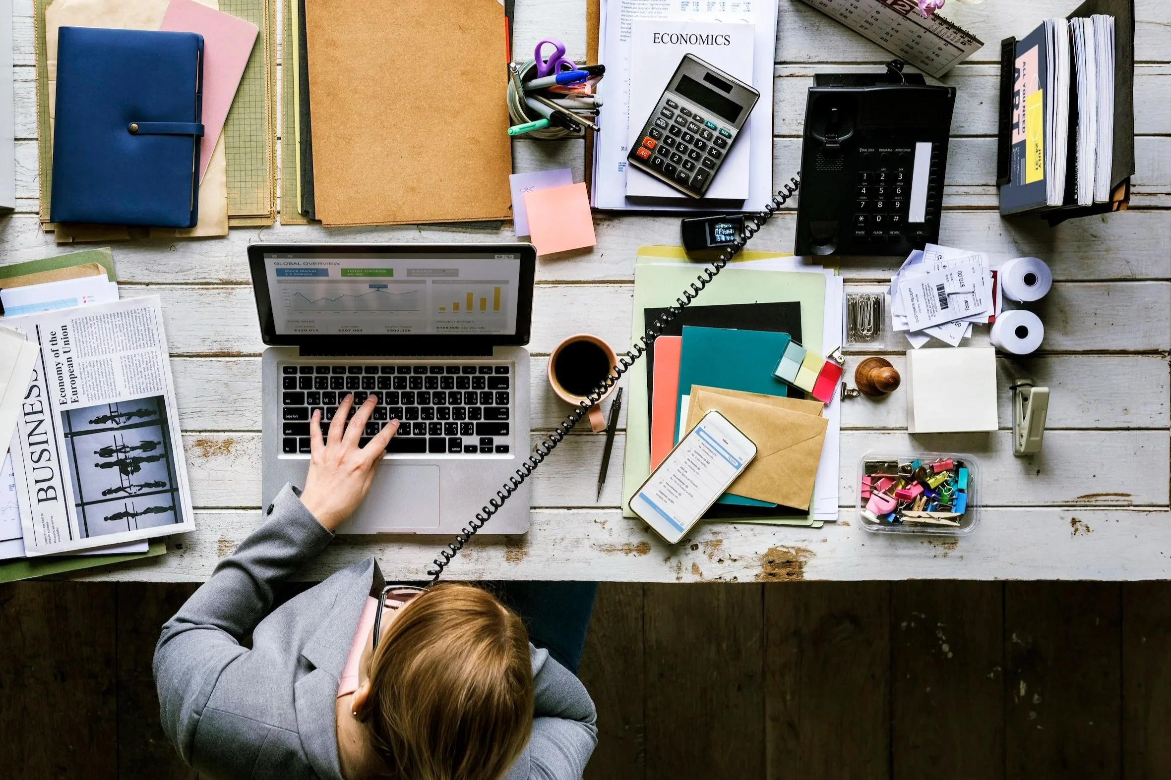 woman multi-tasking at a desk