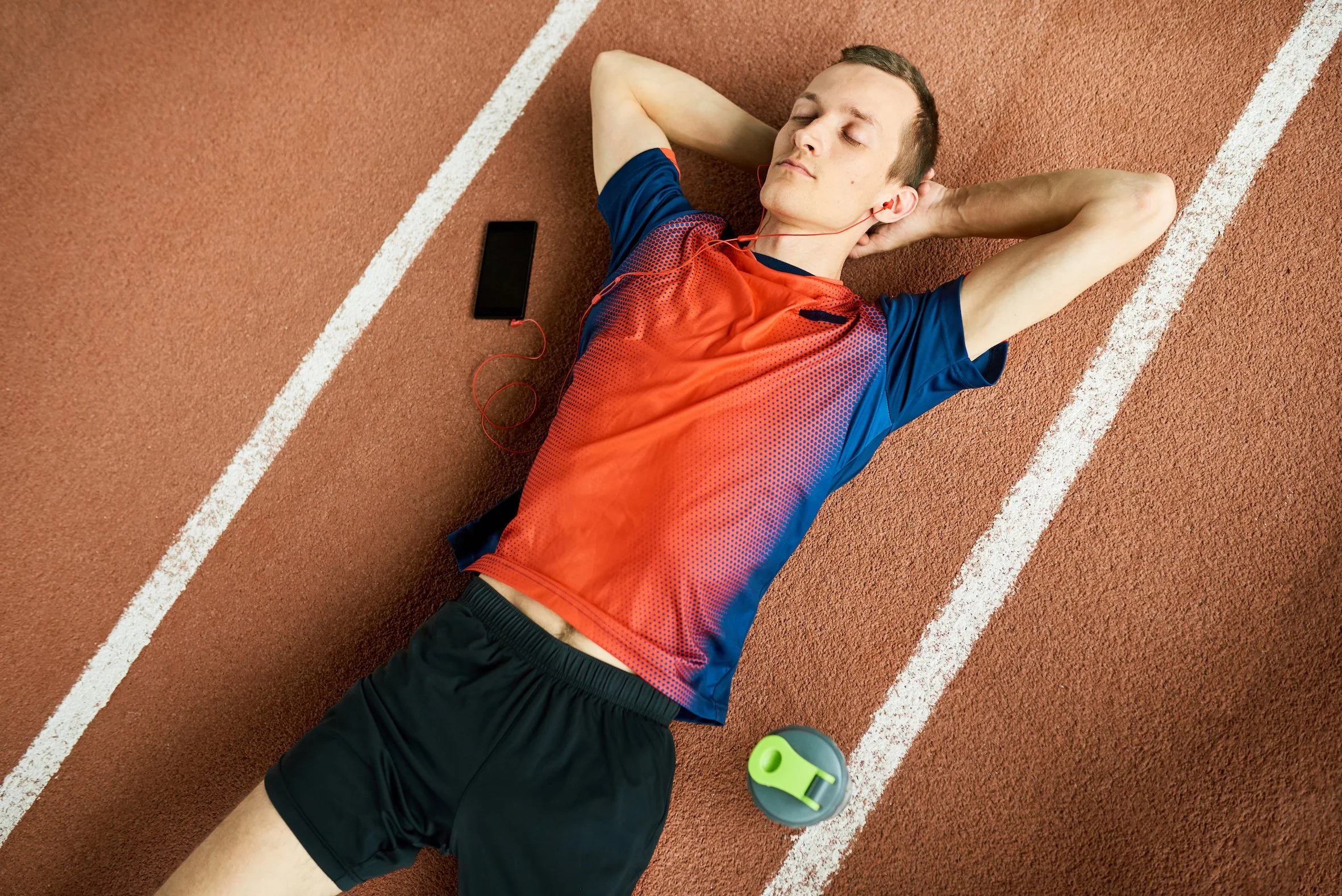 sportsman resting between training with binaural beats