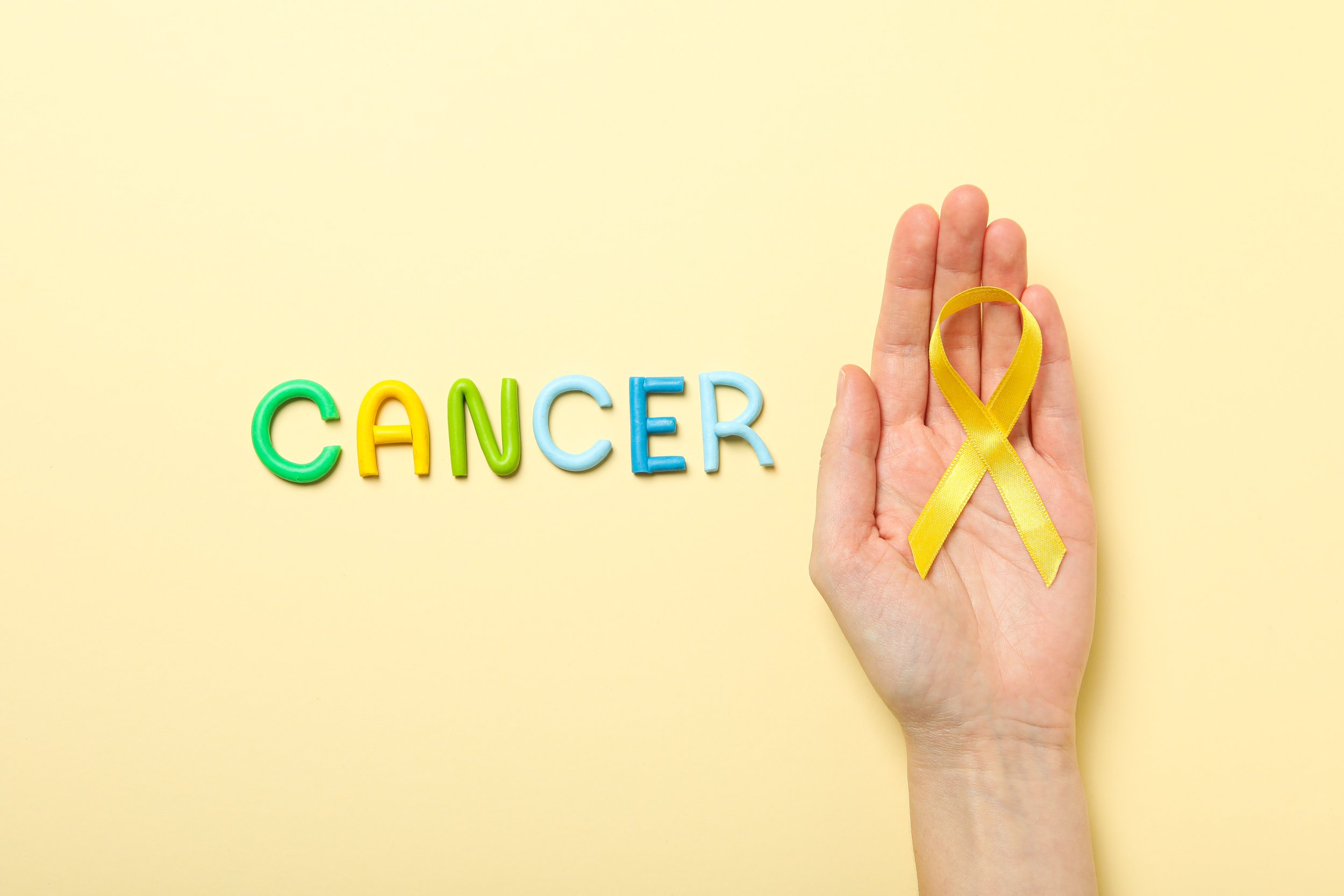 awareness-ribbon-held-with-cancer-typeface-2026-03-24-21-38-25-utc.jpg