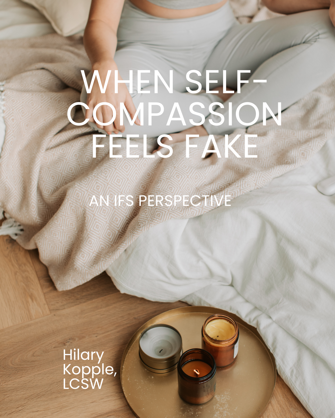 woman in yoga clothes sitting crossed legged on a blanket with candles after doing ifs therapy nyc