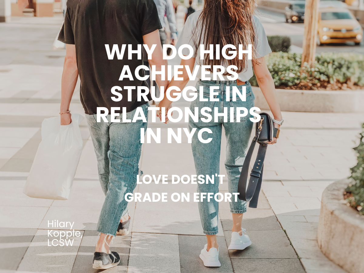 Couple holding hands walking down a sunny NYC city sidewalk, seen from behind