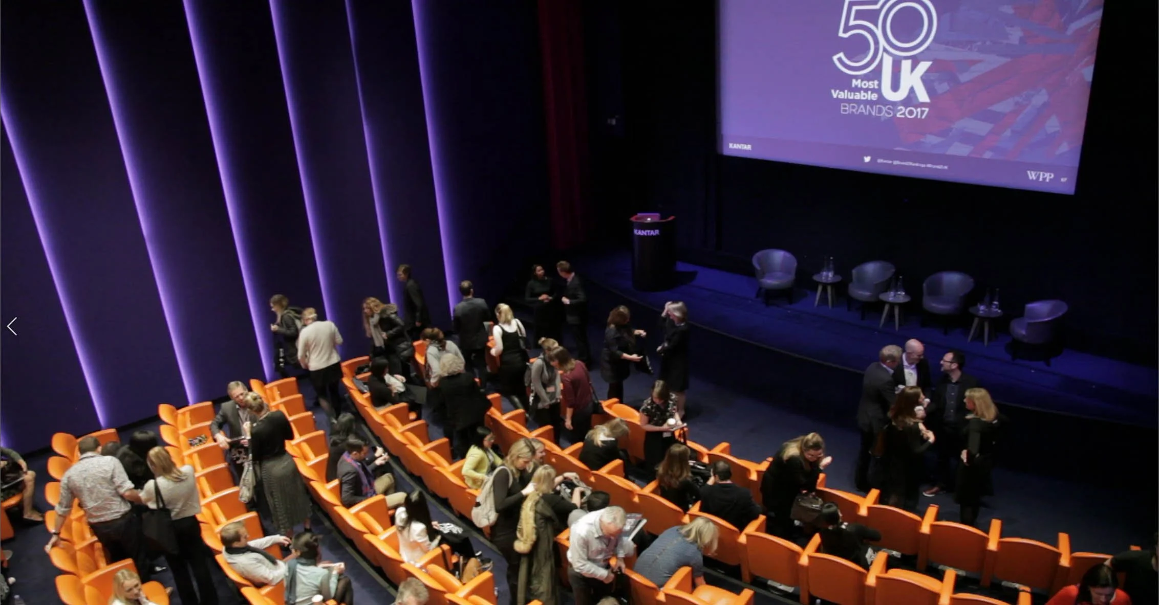 Auditorium with "50 Most Valuable UK Brands 2017": Audience arriving for the 50 Most Valuable UK Brands 2017 presentation with Sir Martin Sorrell.