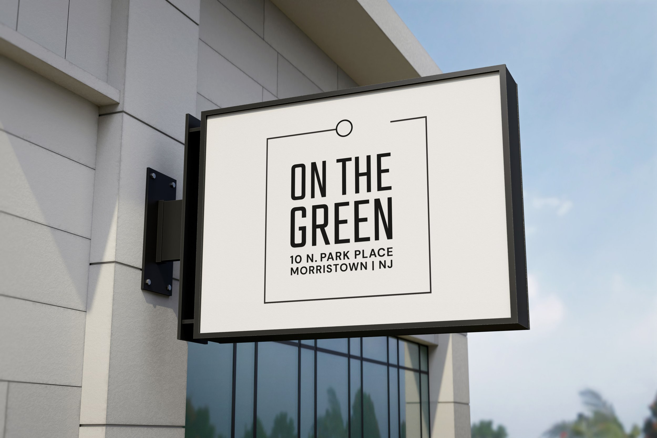 On The Green sign: On The Green logo on building signage in Morristown, New Jersey. Logo design created for JLL US properties.