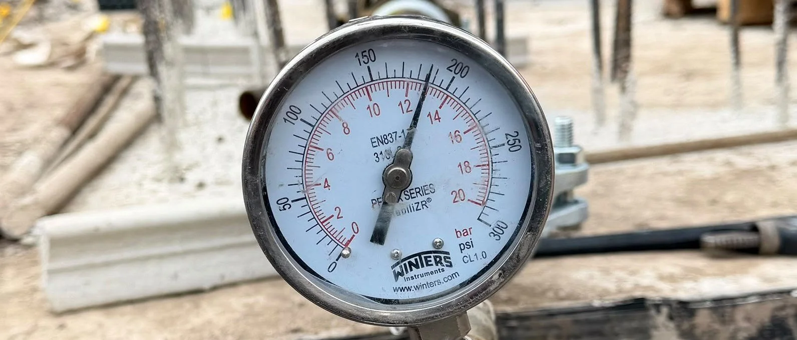 Pressure gauge during underground dry riser pressure testing in Salford, Greater Manchester.