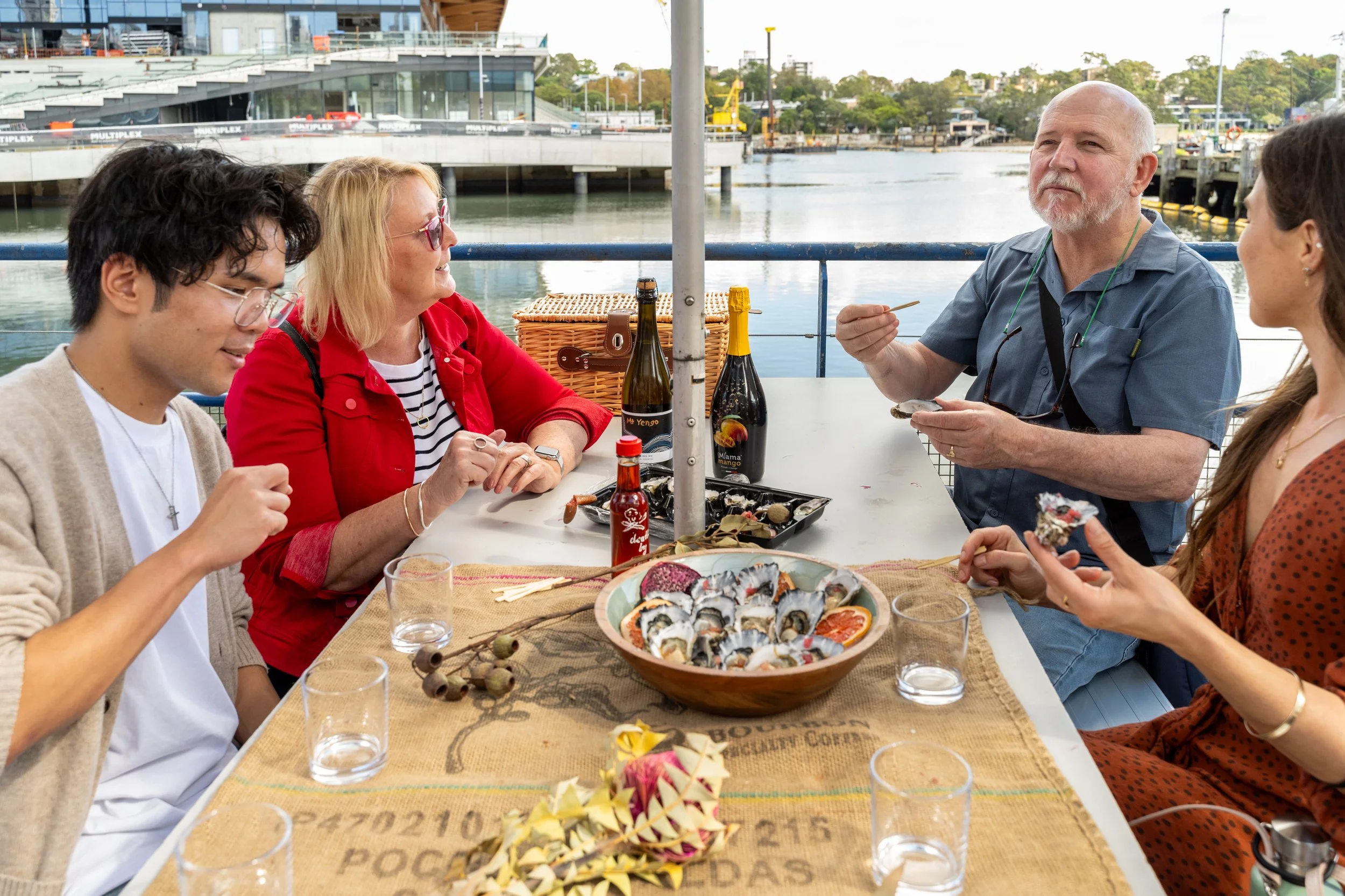 Oyster Tasting by the Water
Description: Group enjoying freshly shucked Sydney oysters with native Australian garnishes during The Australian Food Guy Sydney food tour. A harbourfront foodie experience combining seafood, culture, and bush tucker.
Al