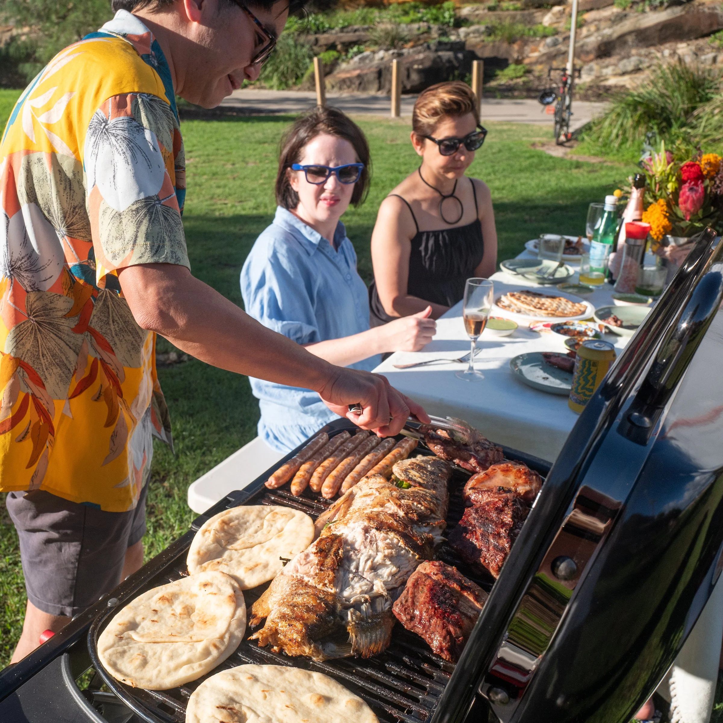 Fresh seafood and premium BBQ meats being cooked during a Sydney Beach BBQ experience with The Australian Food Guy