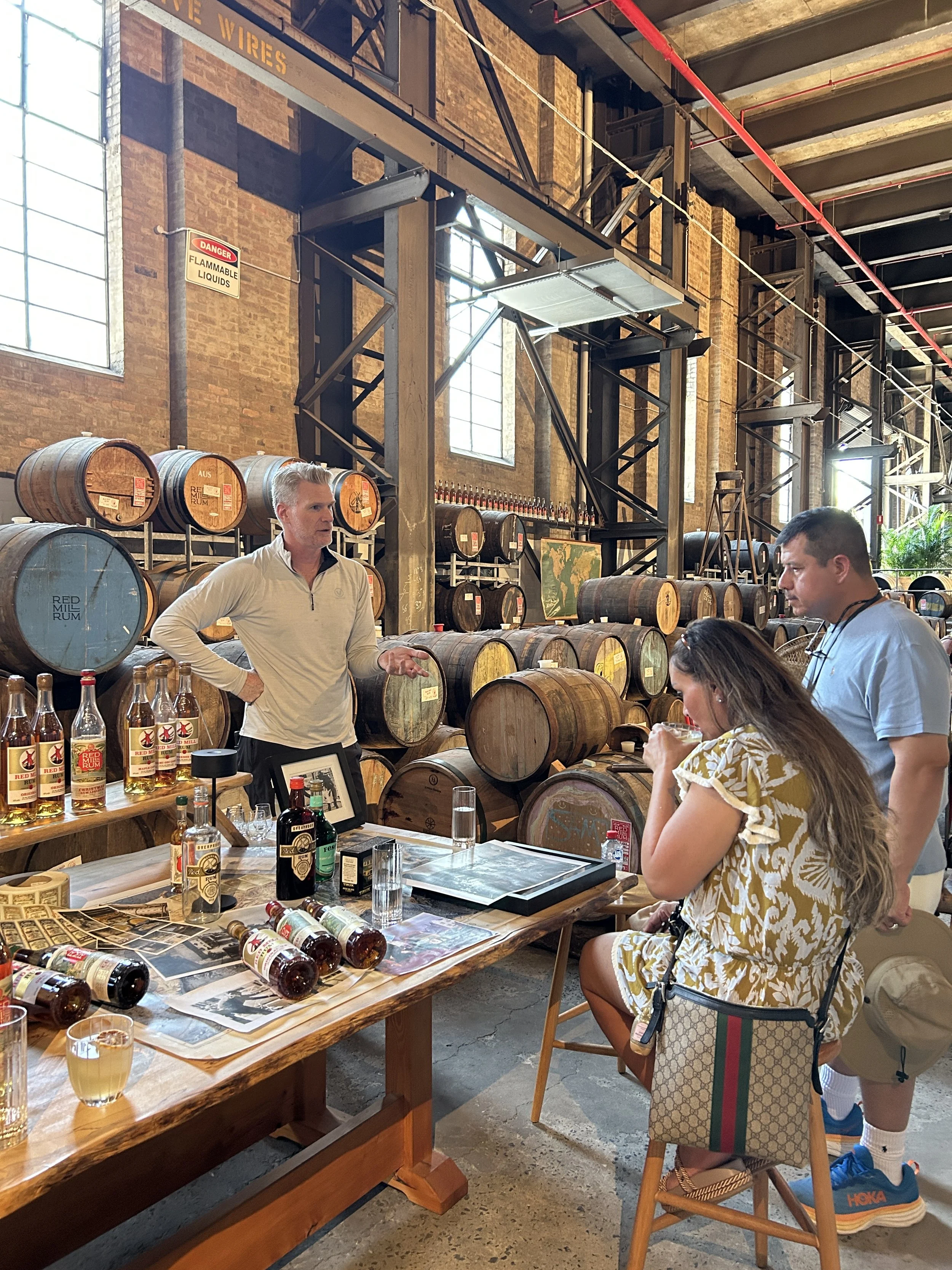 Distillery Tasting Table
Description: Guests sampling rum at Red Mill Distillery with The Australian Food Guy. This Sydney food tour combines bush tucker storytelling with local spirits for an unforgettable gourmet experience.
Alt Text: Guests tasti
