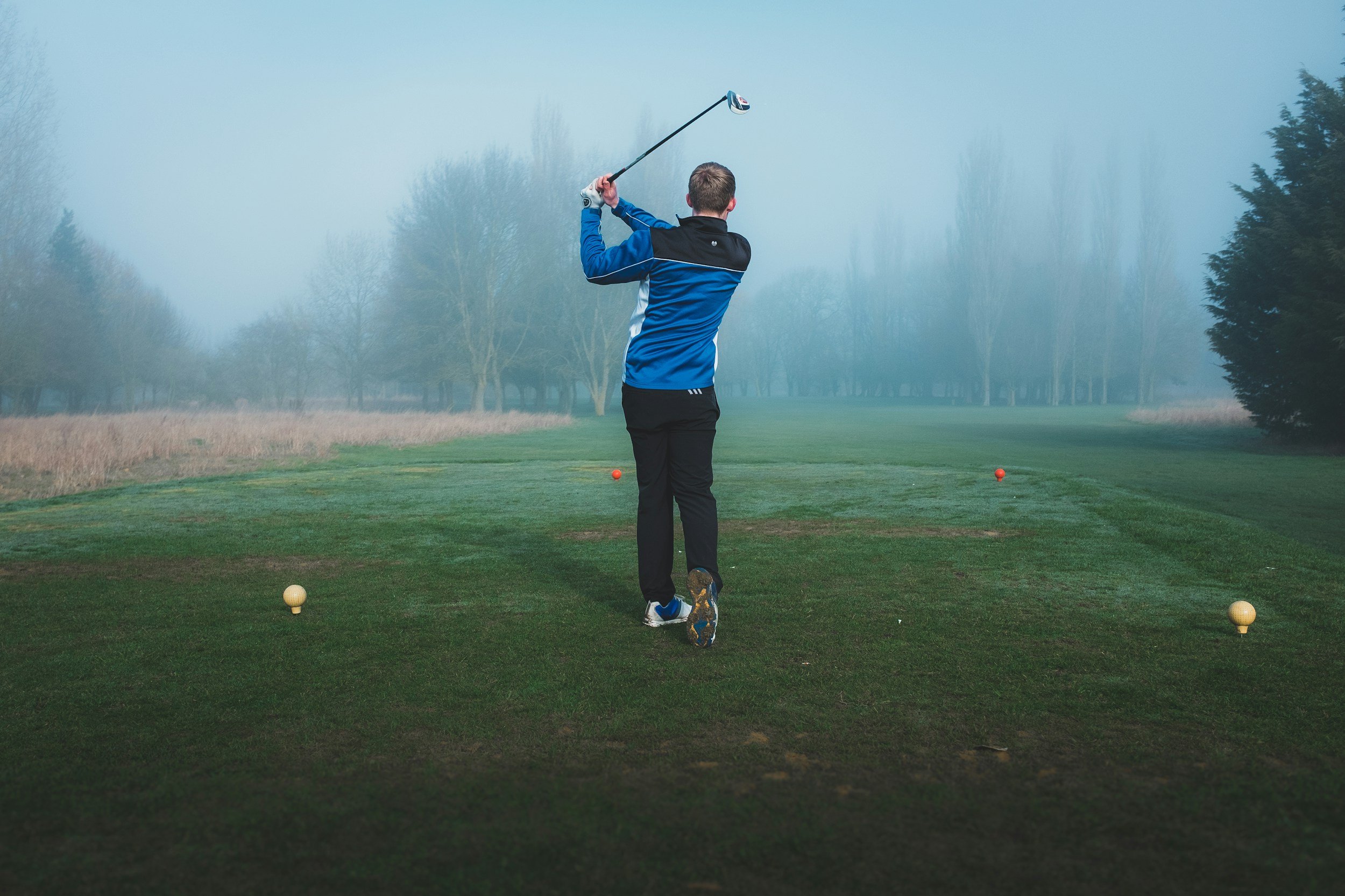 Stock image of man playing golf