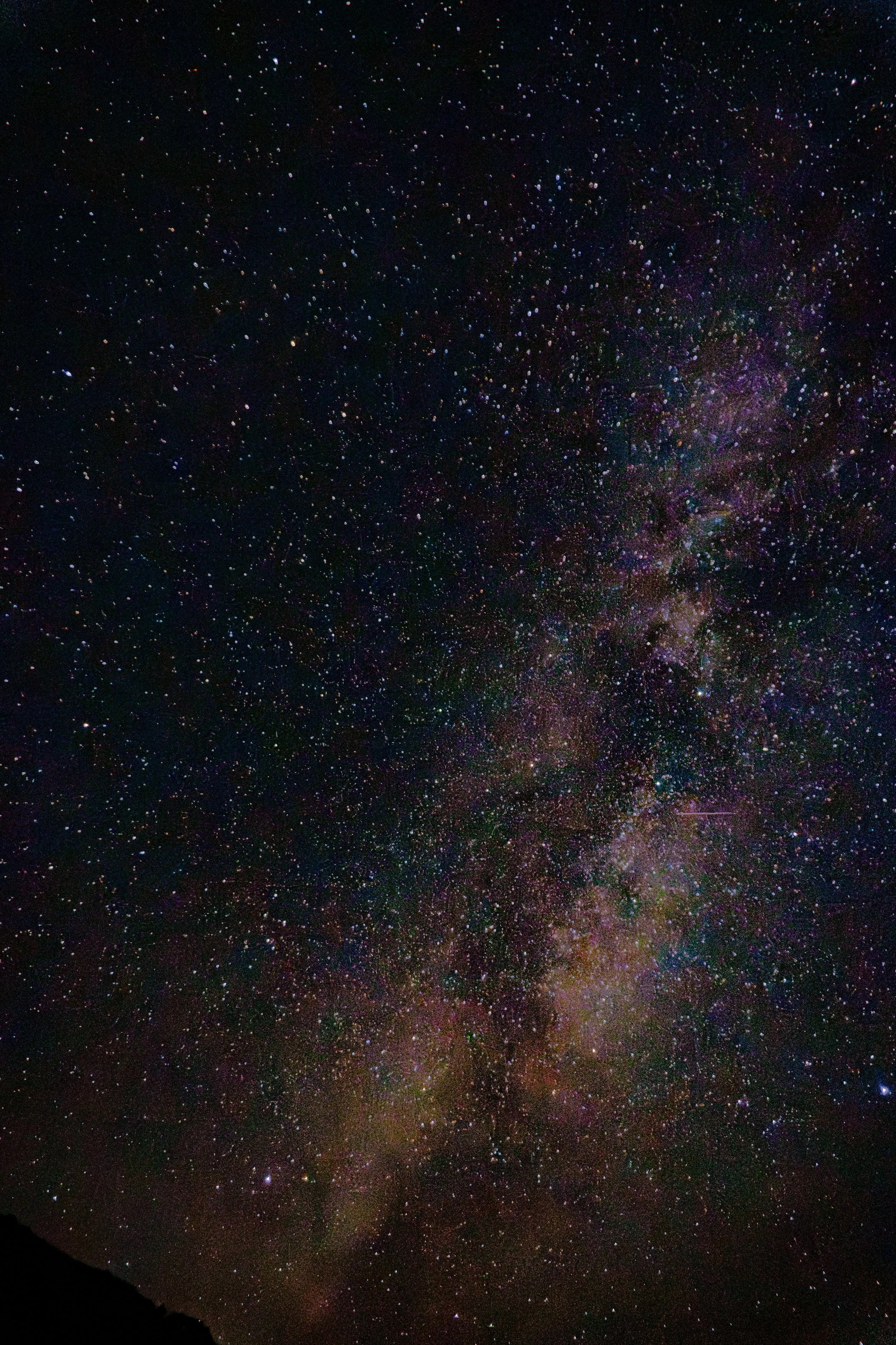 Night sky filled with stars and a visible section of the Milky Way galaxy.
