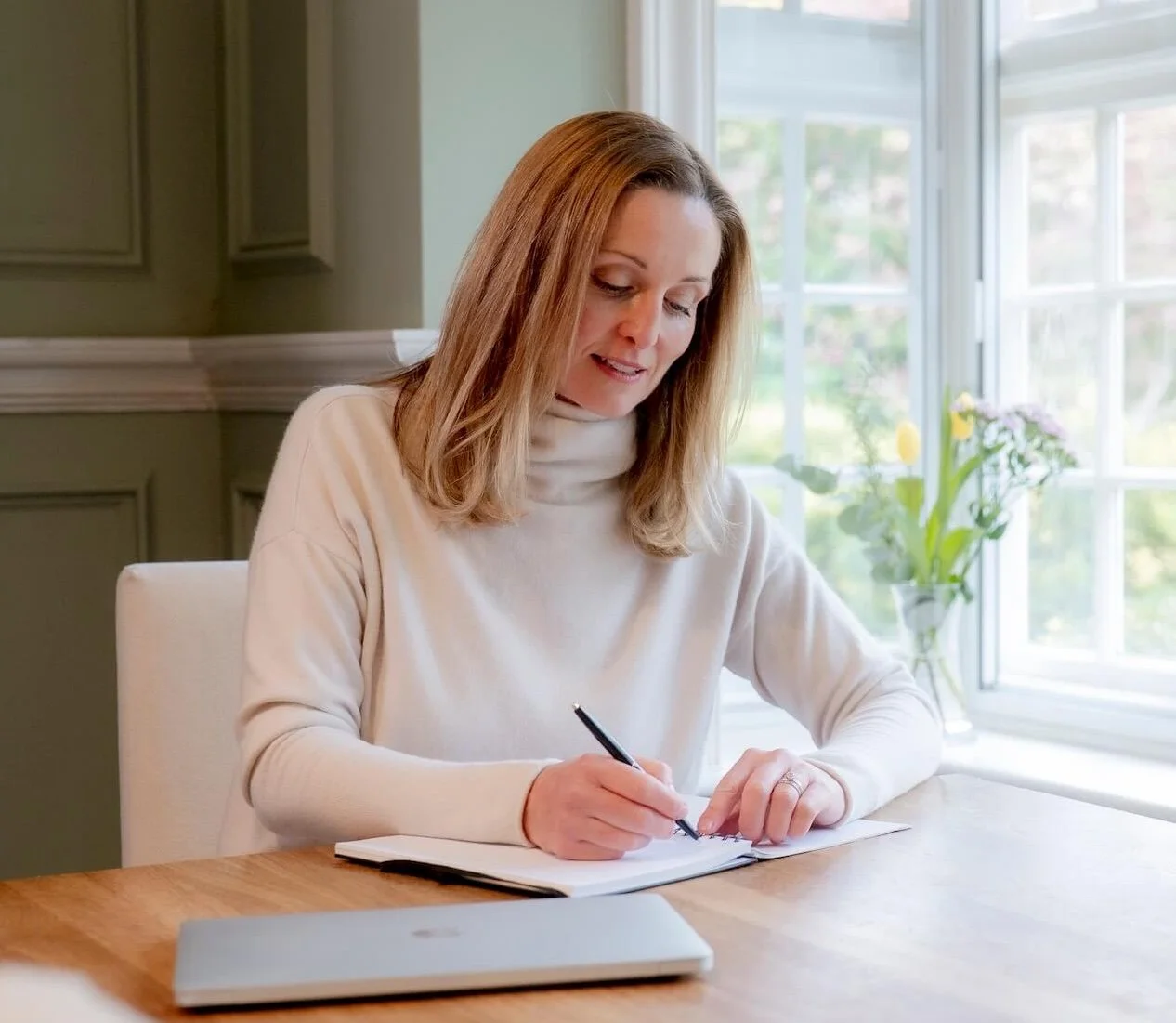 Niamh Ward, Registered Nutritionist and Health Coach, at work writing