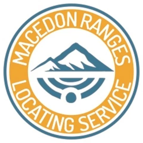 Logo of MacedoN Ranges Lodging Service featuring mountains and a circular design.