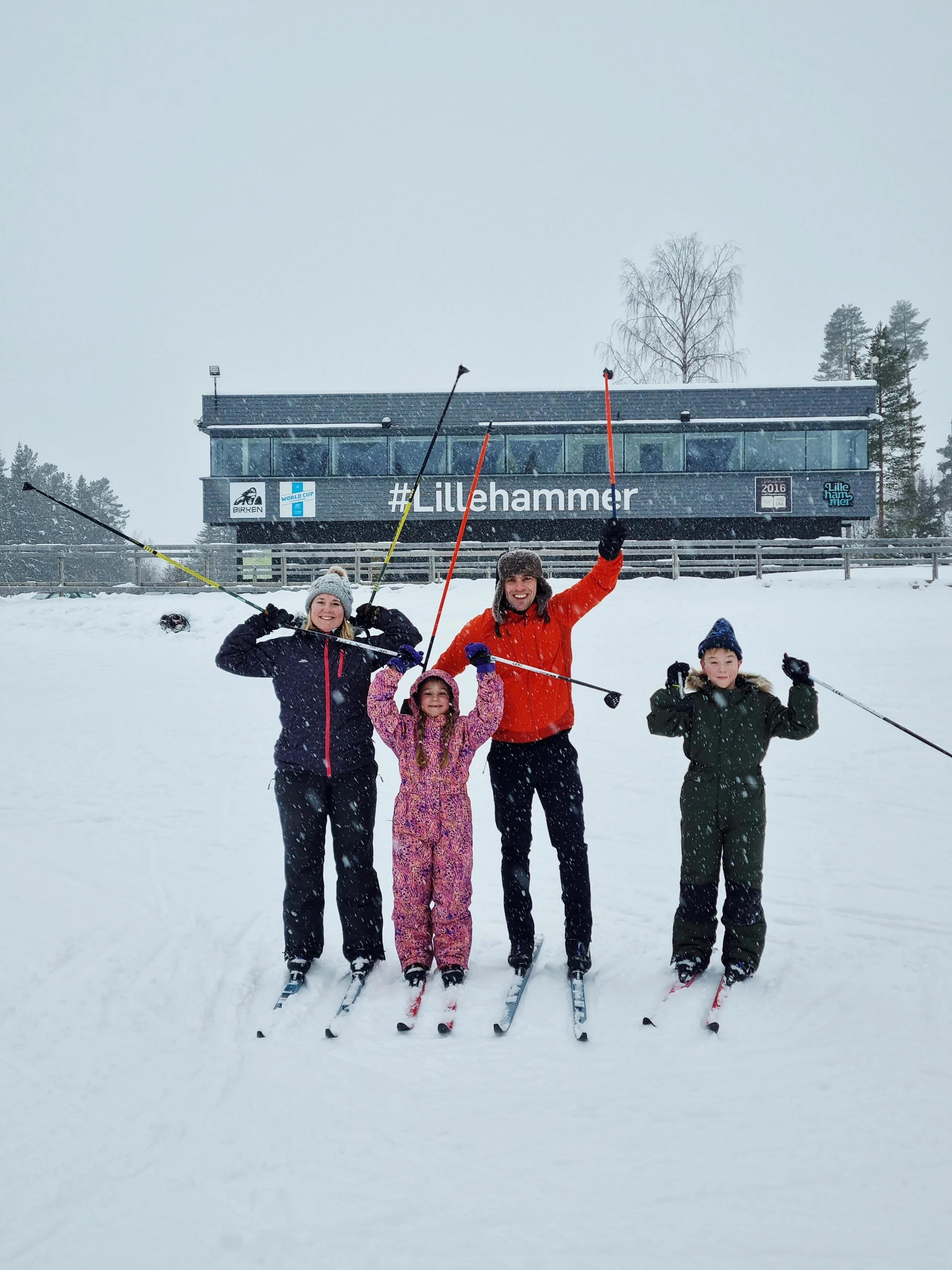 Family learning cross-country skiing during a beginner lesson in Lillehammer