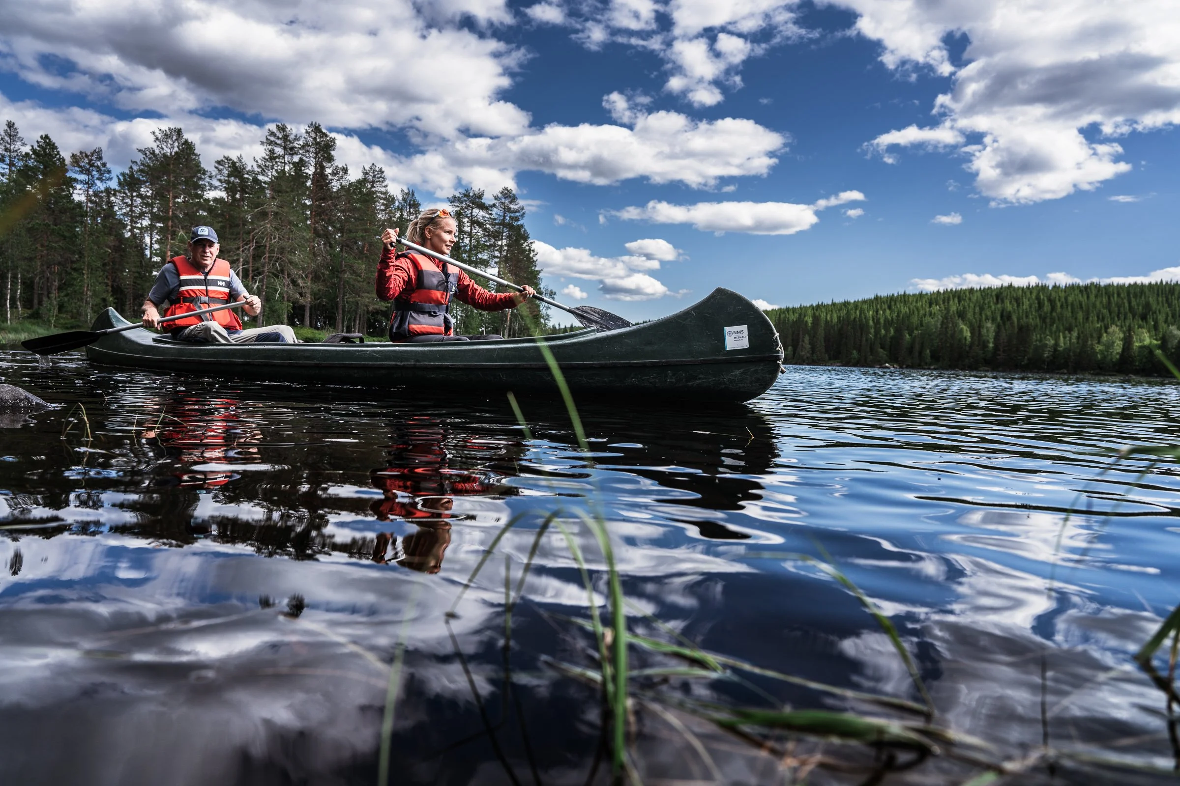 Quiet guided canoe tour through peaceful Norwegian nature