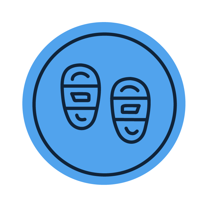 a blue round icon of snowshoes