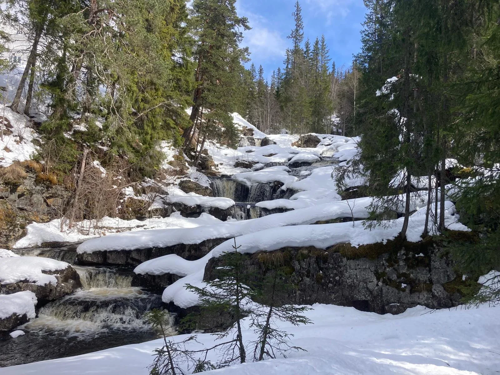 A river bed in winter with snow at its banks