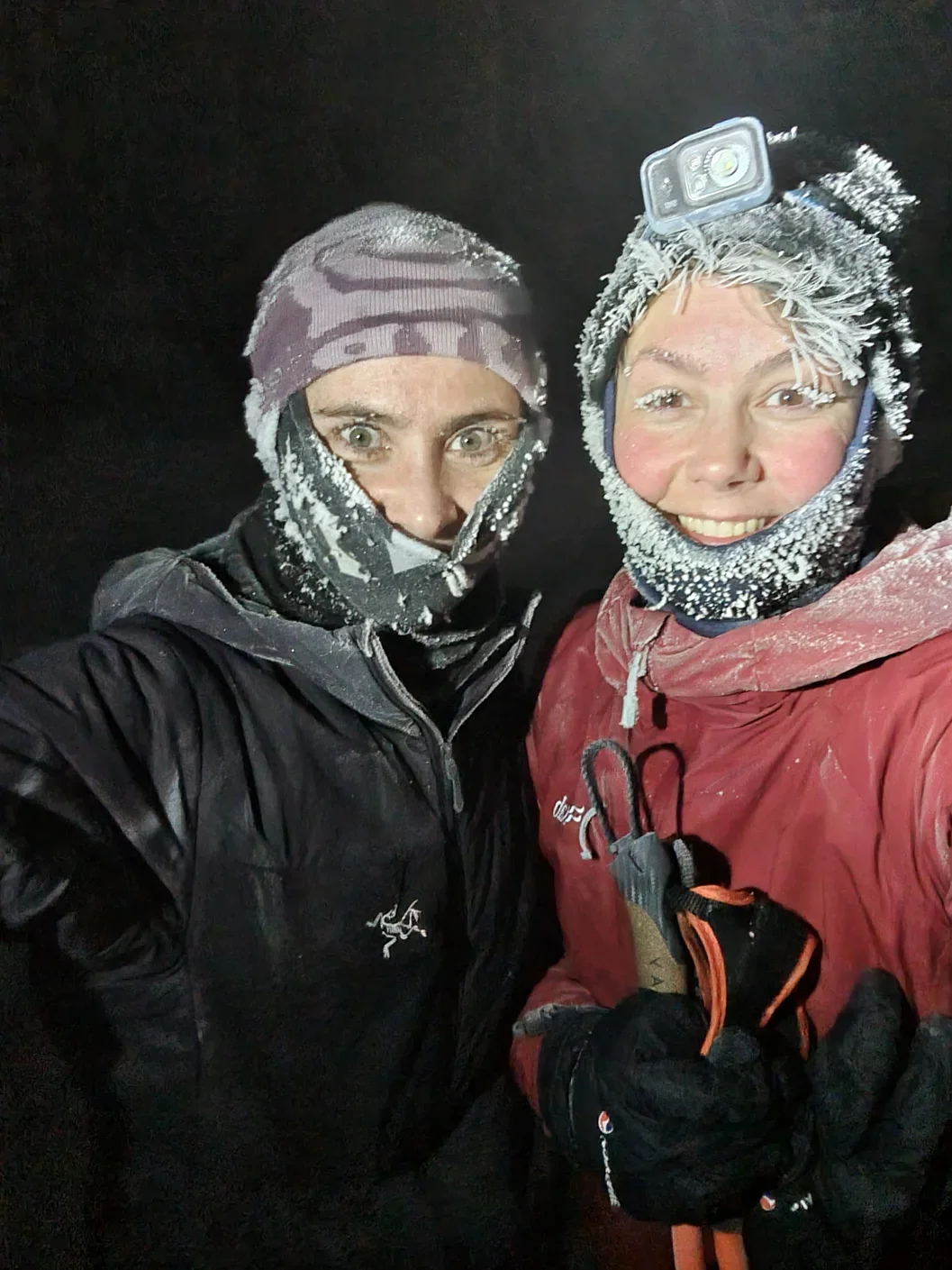 A selfie of two women in winter clothing covered in frost around there faces