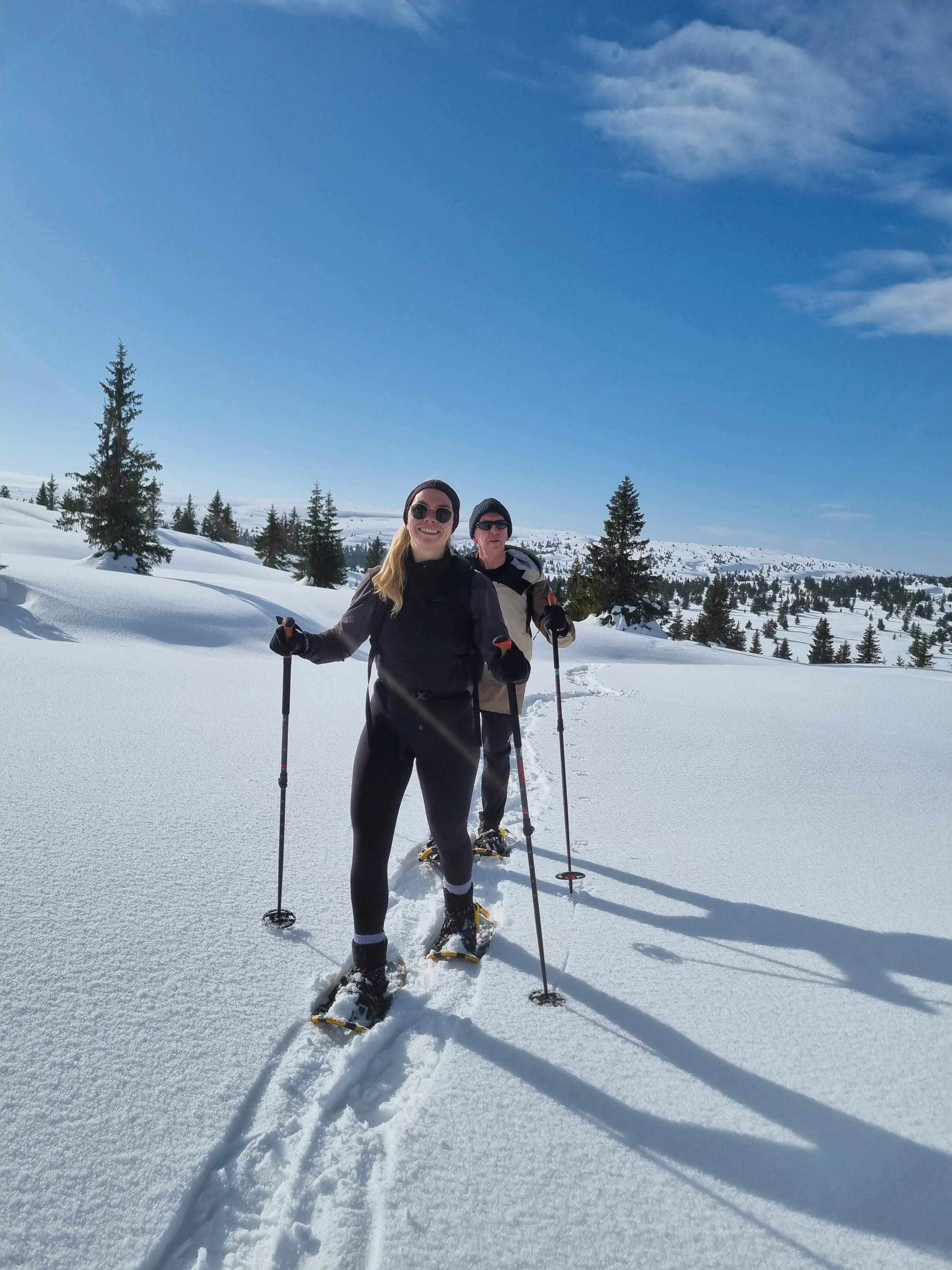 Family enjoying a guided snowshoe adventure in the winter landscape near Lillehammer