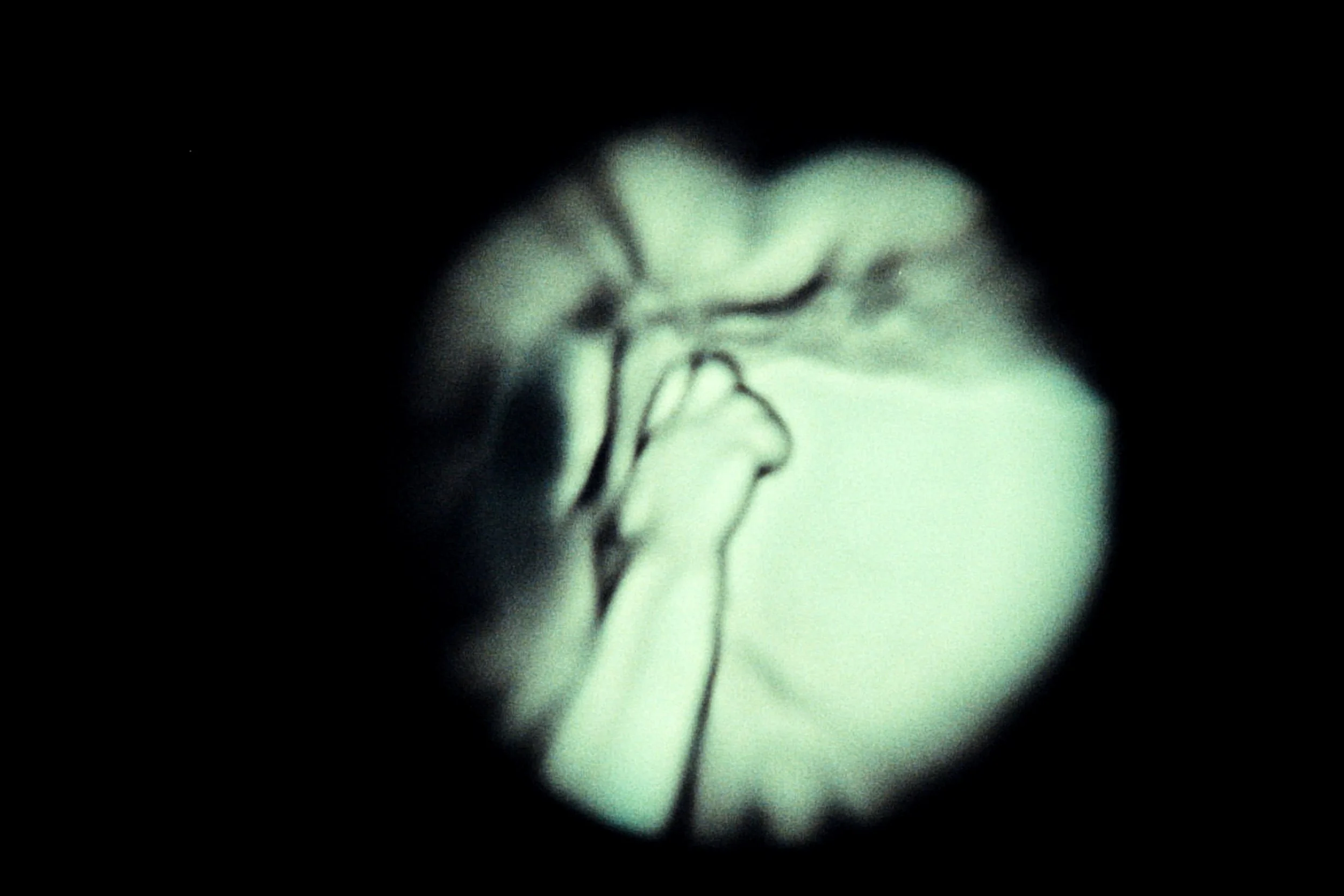 Black and white ultrasound image of a fetus in the womb.