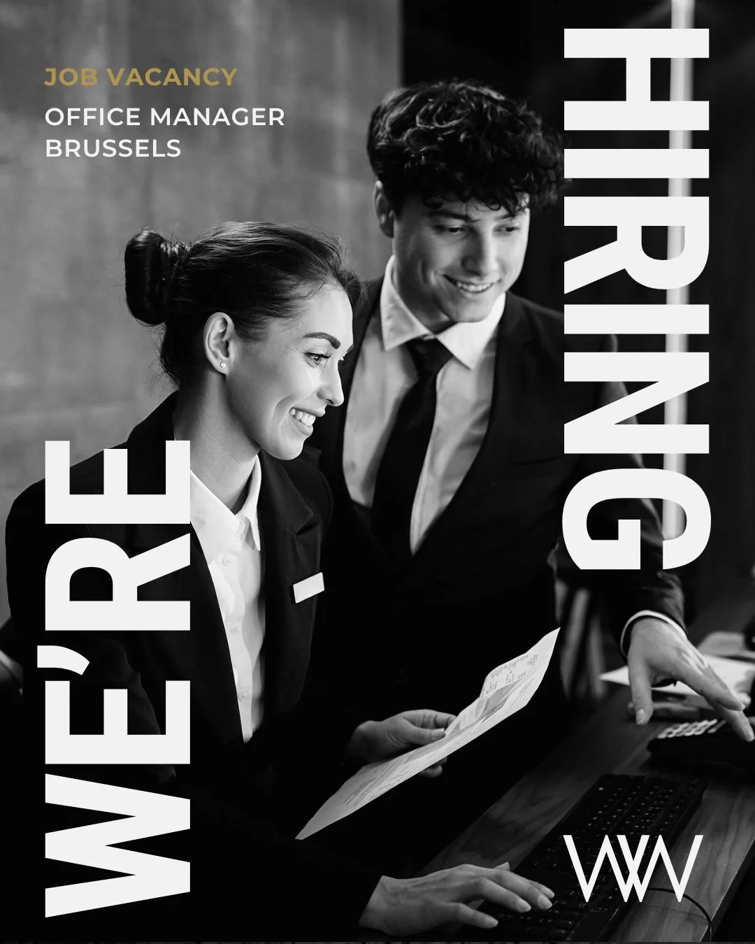 Black and white photo of two smiling young professionals, a woman and a man, dressed in business attire, looking at documents together. Text overlay says "We're Hiring Office Manager Brussels."