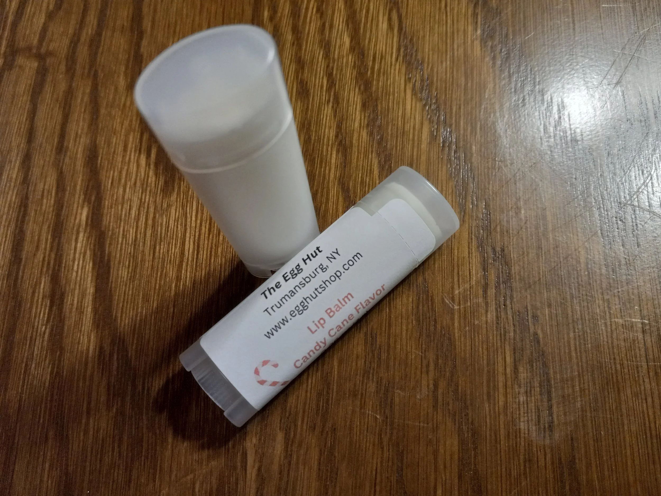 unlabeled and labeled lip balm tubes.
