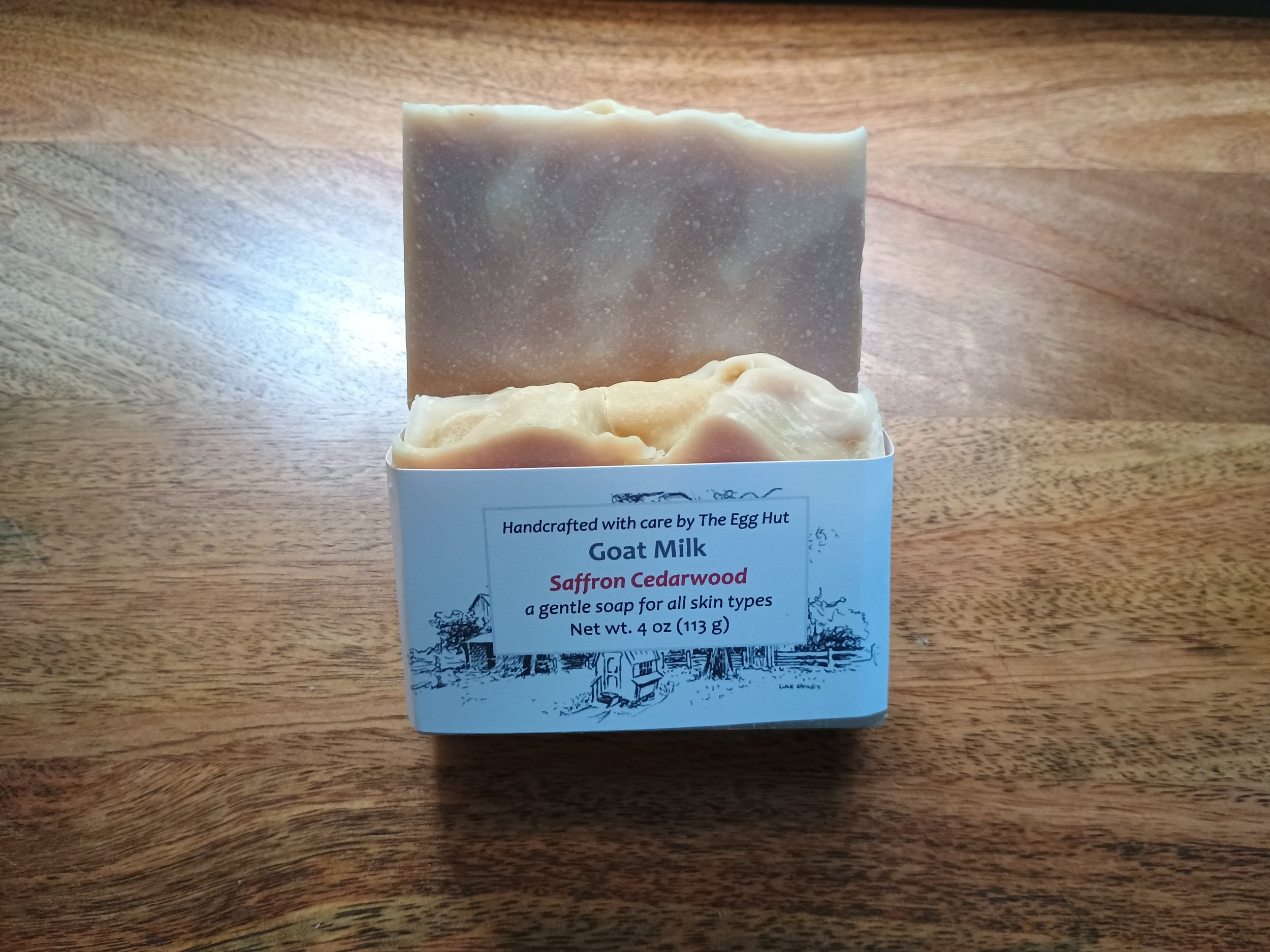 Safron Cederwood soap package with tan soap and white colored droplets