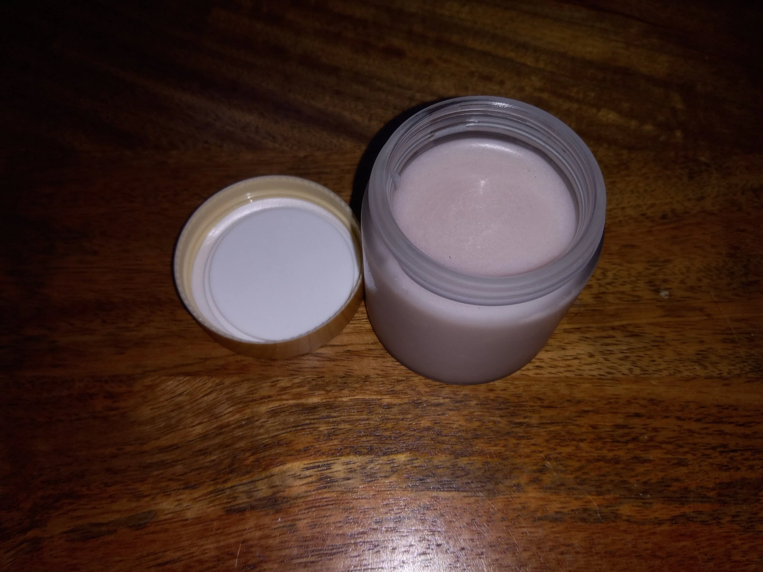 frosted jar with lavender colored sugar scrub.