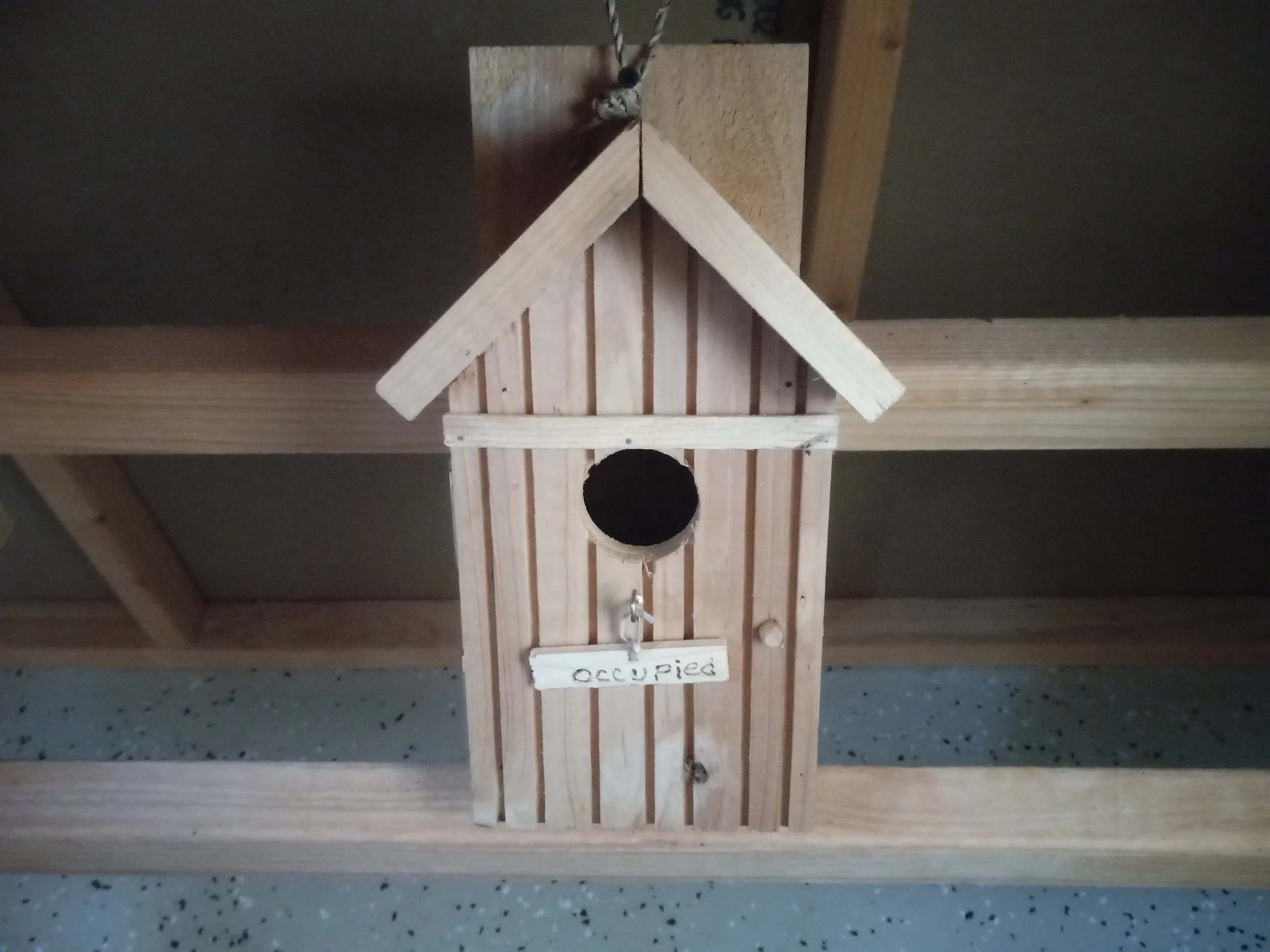 bird house with vacant/occupied sign