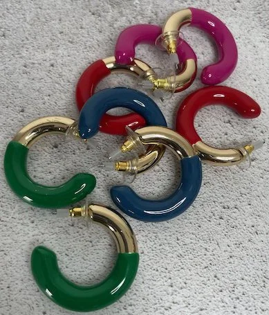 Colorful gold and plastic links arranged on a light gray surface.