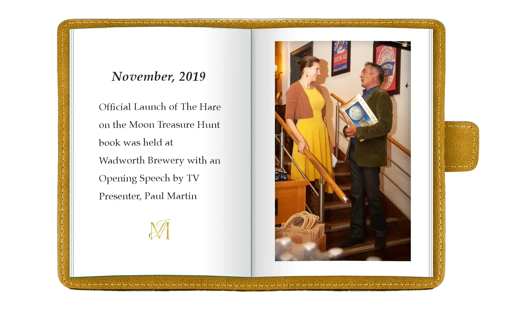 Open book with text on the left page about a November 2019 event at Wadworth Brewery, and a photograph of a woman in a yellow dress and brown cardigan talking to a man holding a book on a staircase inside a brewery or pub.