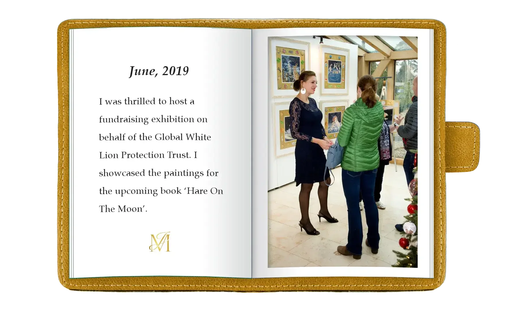 An open photo album showing a page with text and a photo. The text is about a fundraising exhibition in June 2019 for the Global White Lion Protection Trust. The photo shows a woman in a black lace dress and heels talking to two women; one wears a gr