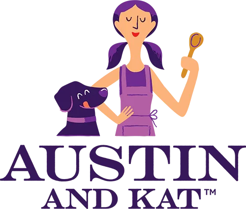 A woman with purple hair and a purple apron holding a mirror, appearing to pet a purple dog, with the text "AUSTIN AND KAT" beneath them.